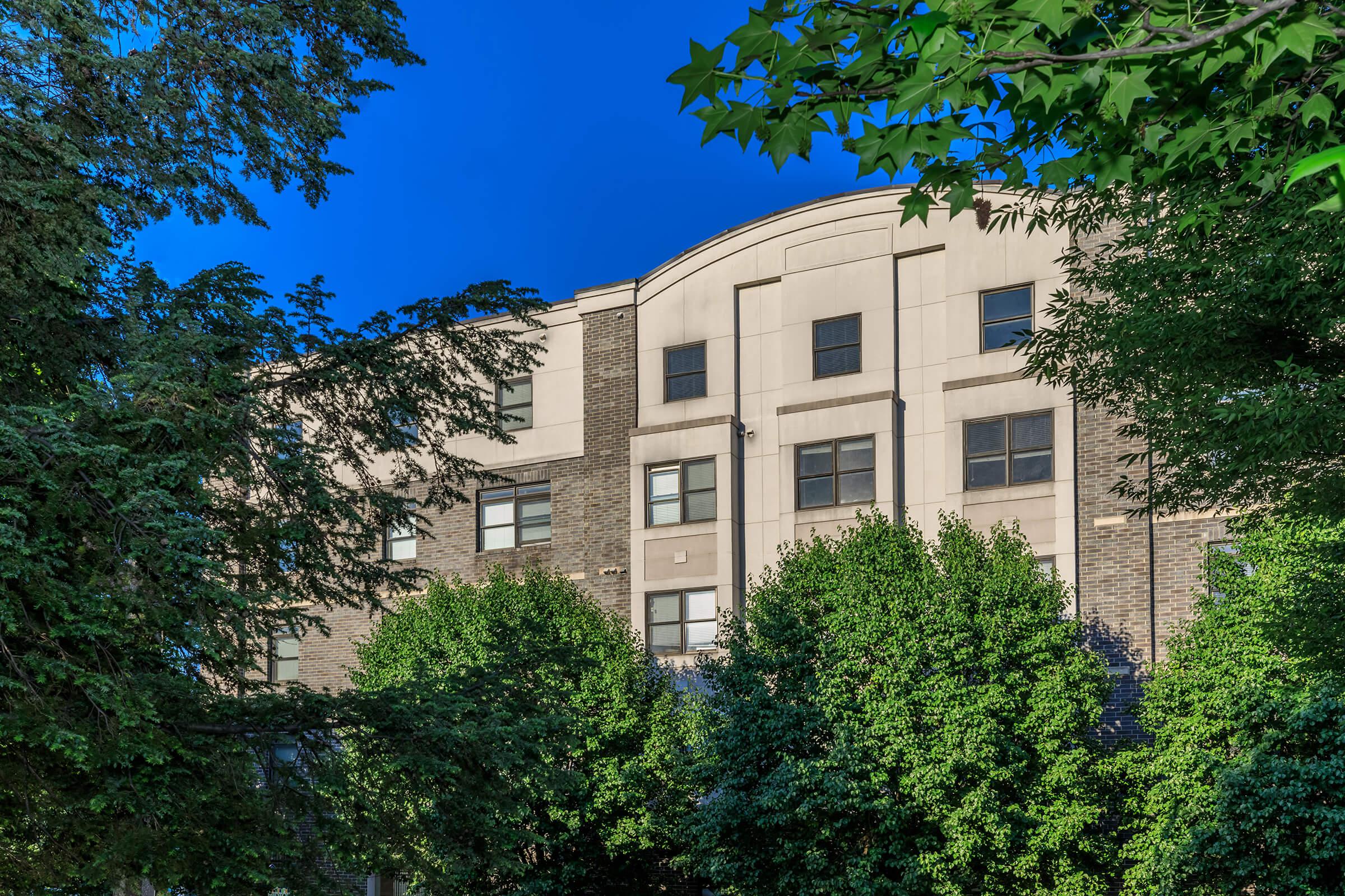 a tree in front of a building