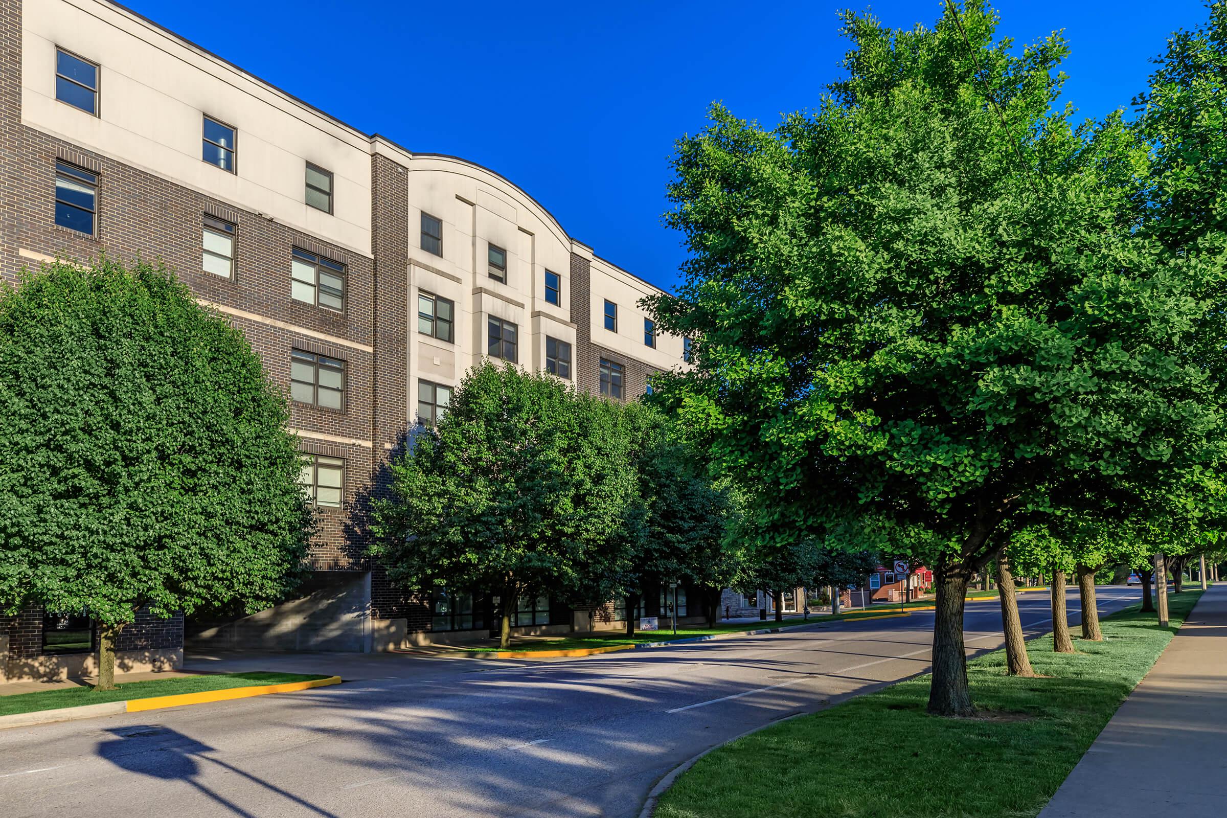 a road with a building in the background