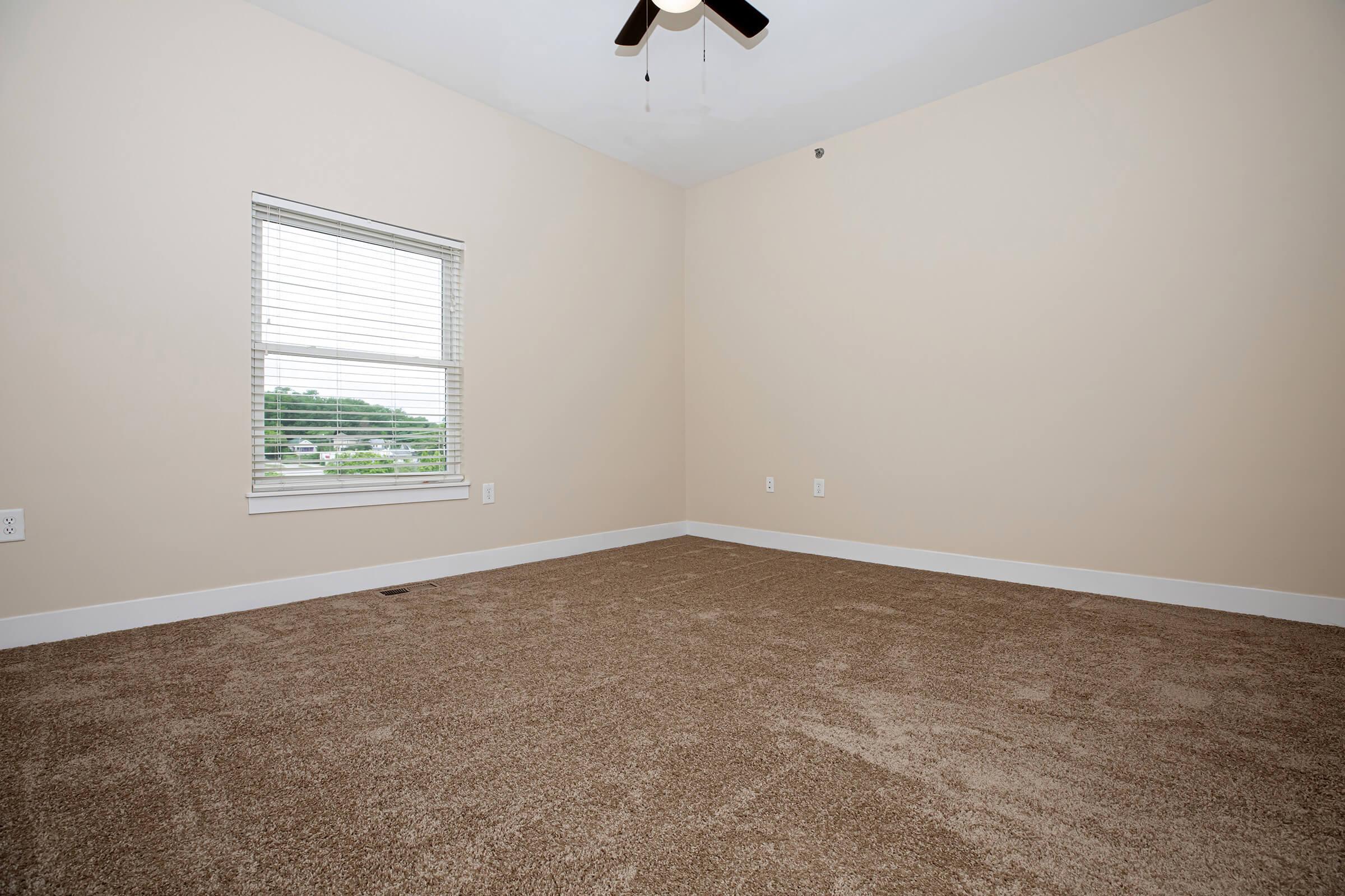 a bedroom with a large window