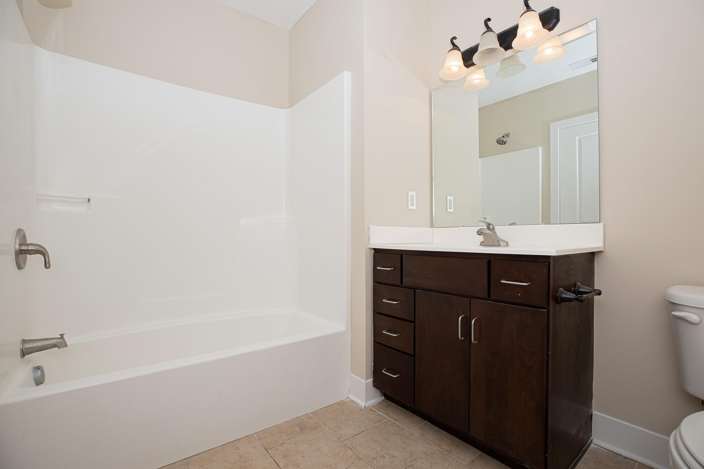 a room with a sink and a shower