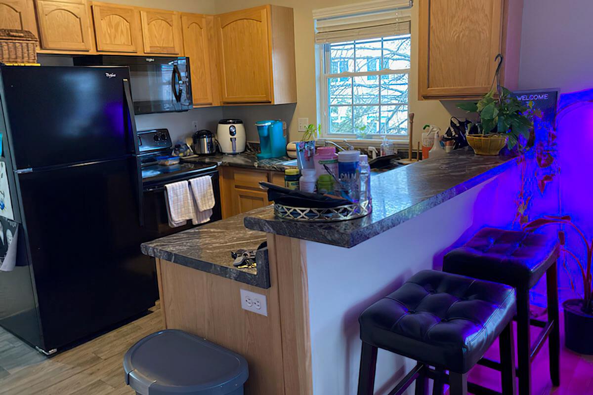 a kitchen with an island in the middle of a room