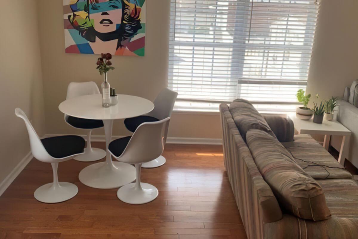 a living room filled with furniture and a large window