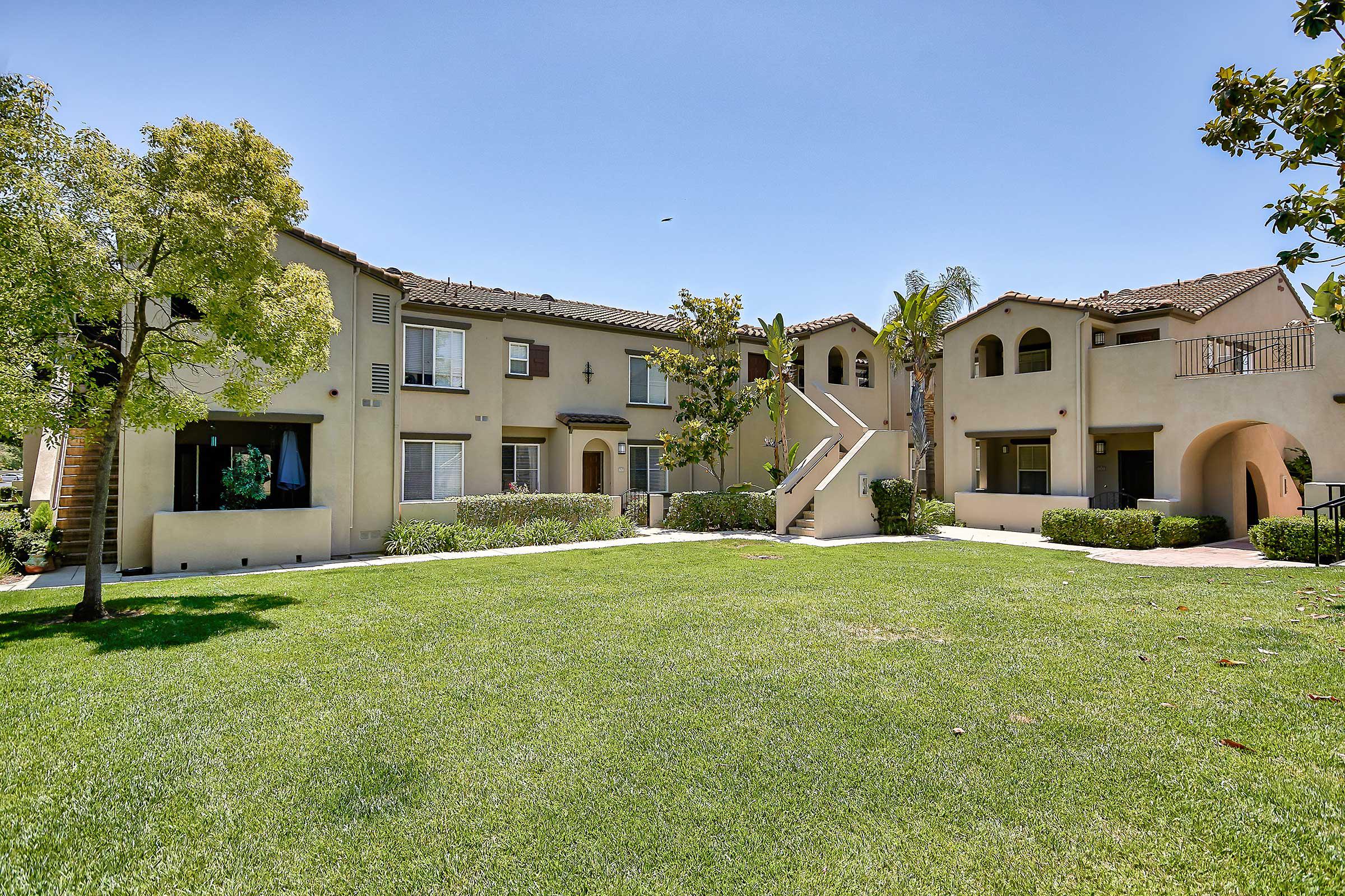 Laurel Canyon Apartment Homes community building with a green grass