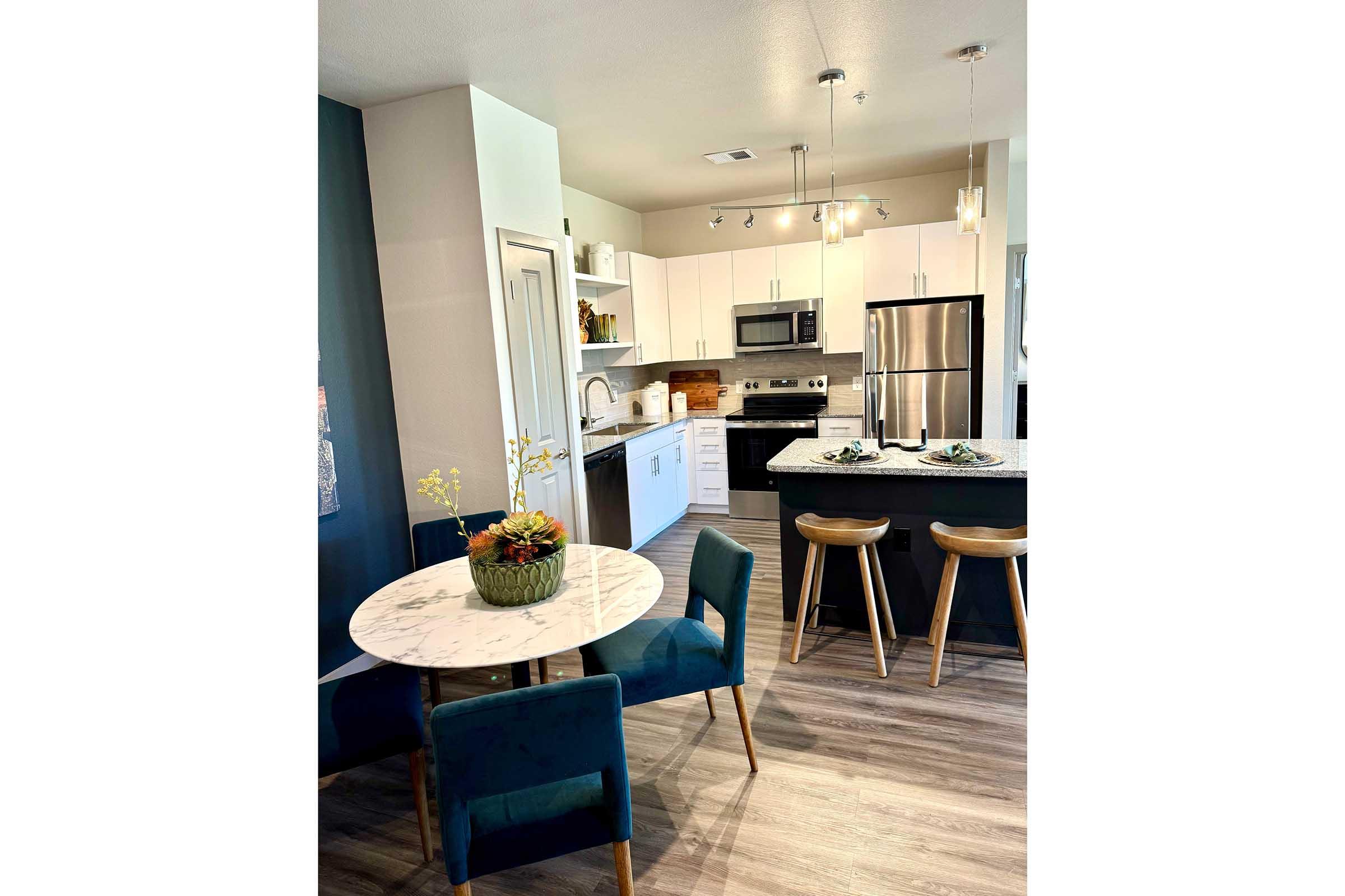 a kitchen with a table in a room