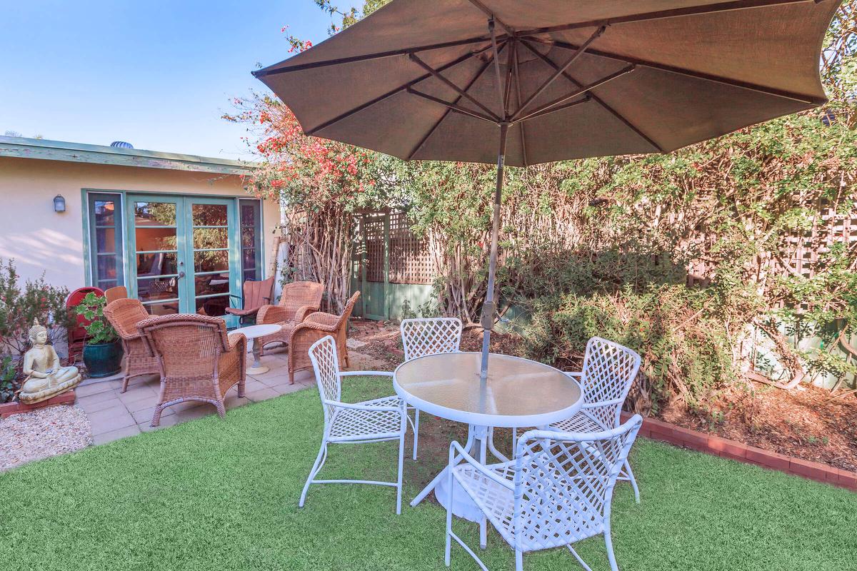 a lawn chair under an umbrella