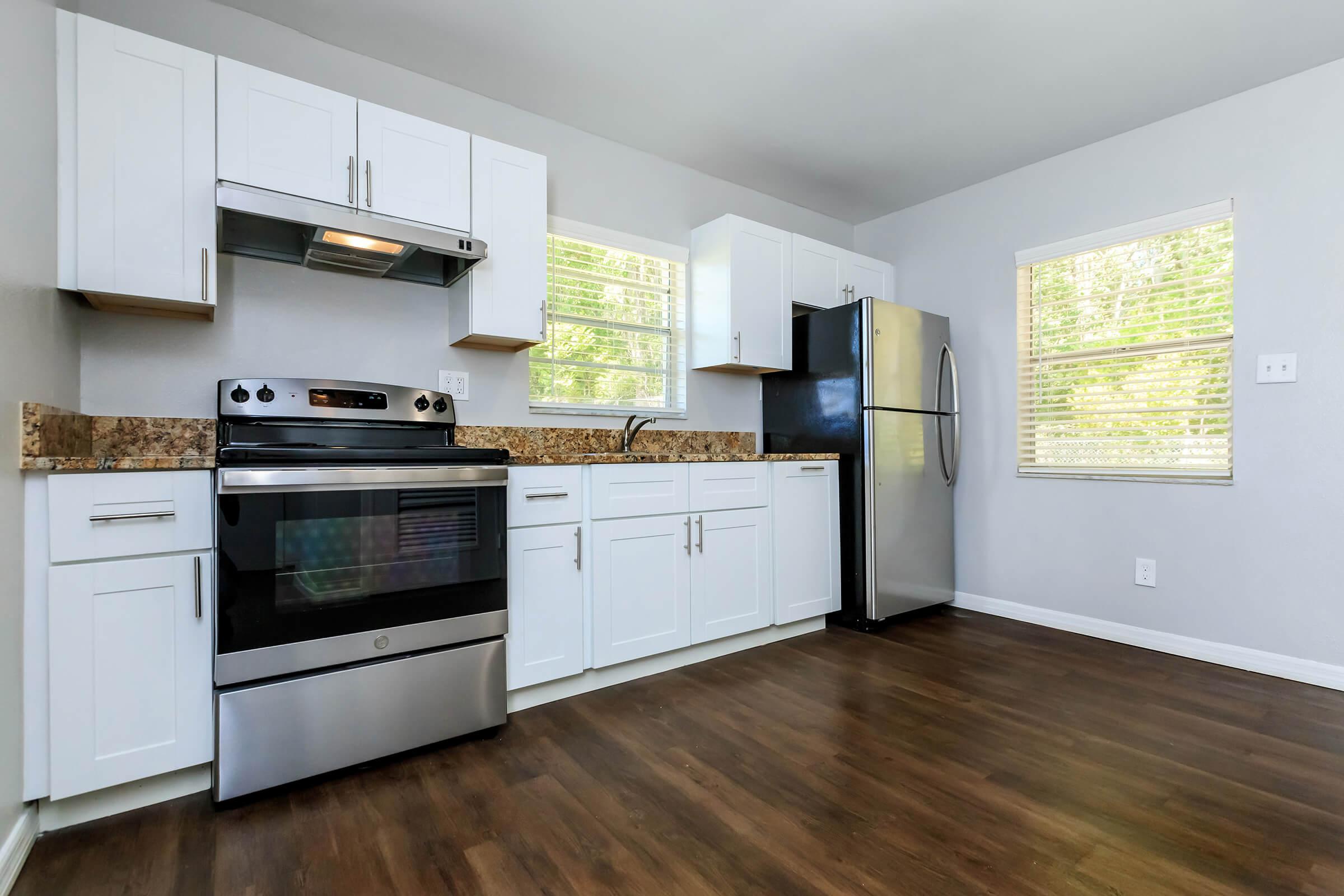 a kitchen with a wood floor