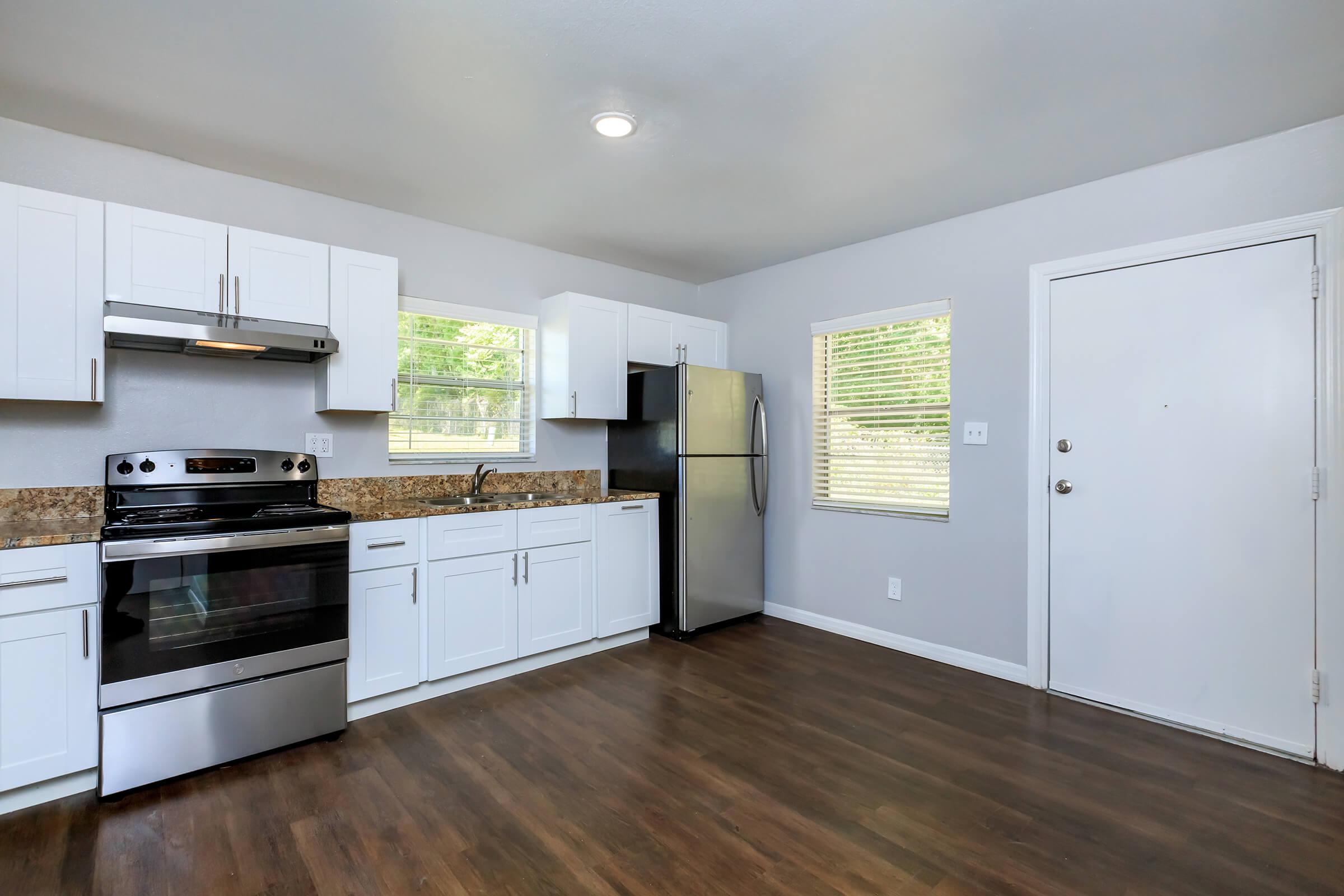 a kitchen with a wood floor