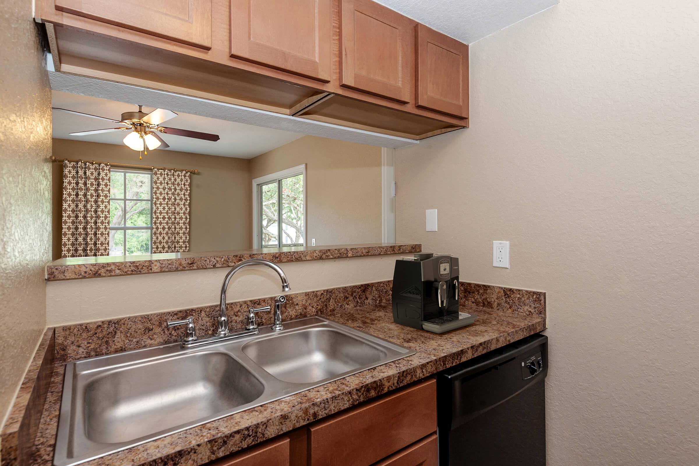 a kitchen with a stove and a sink