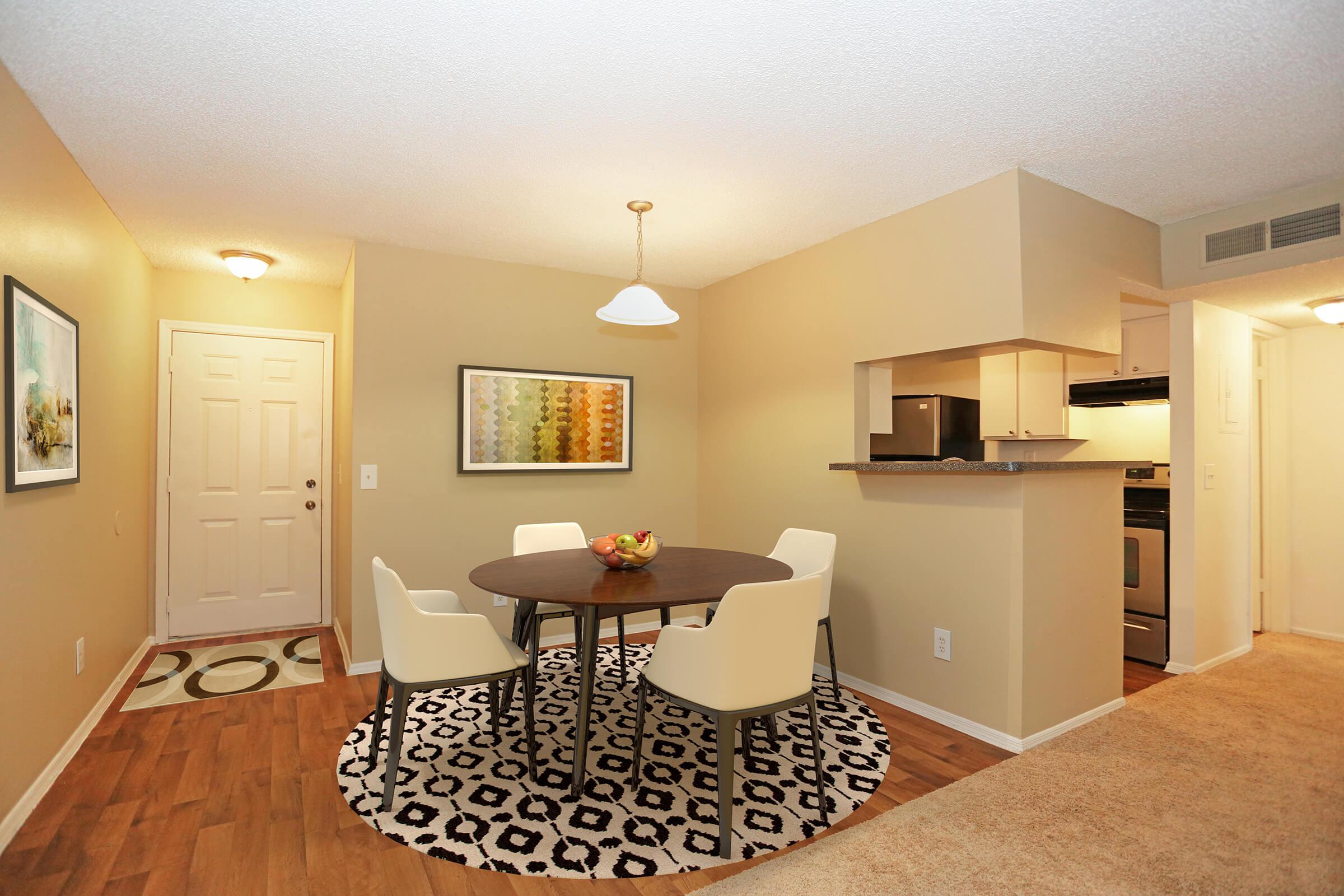 a living room filled with furniture and a flat screen tv
