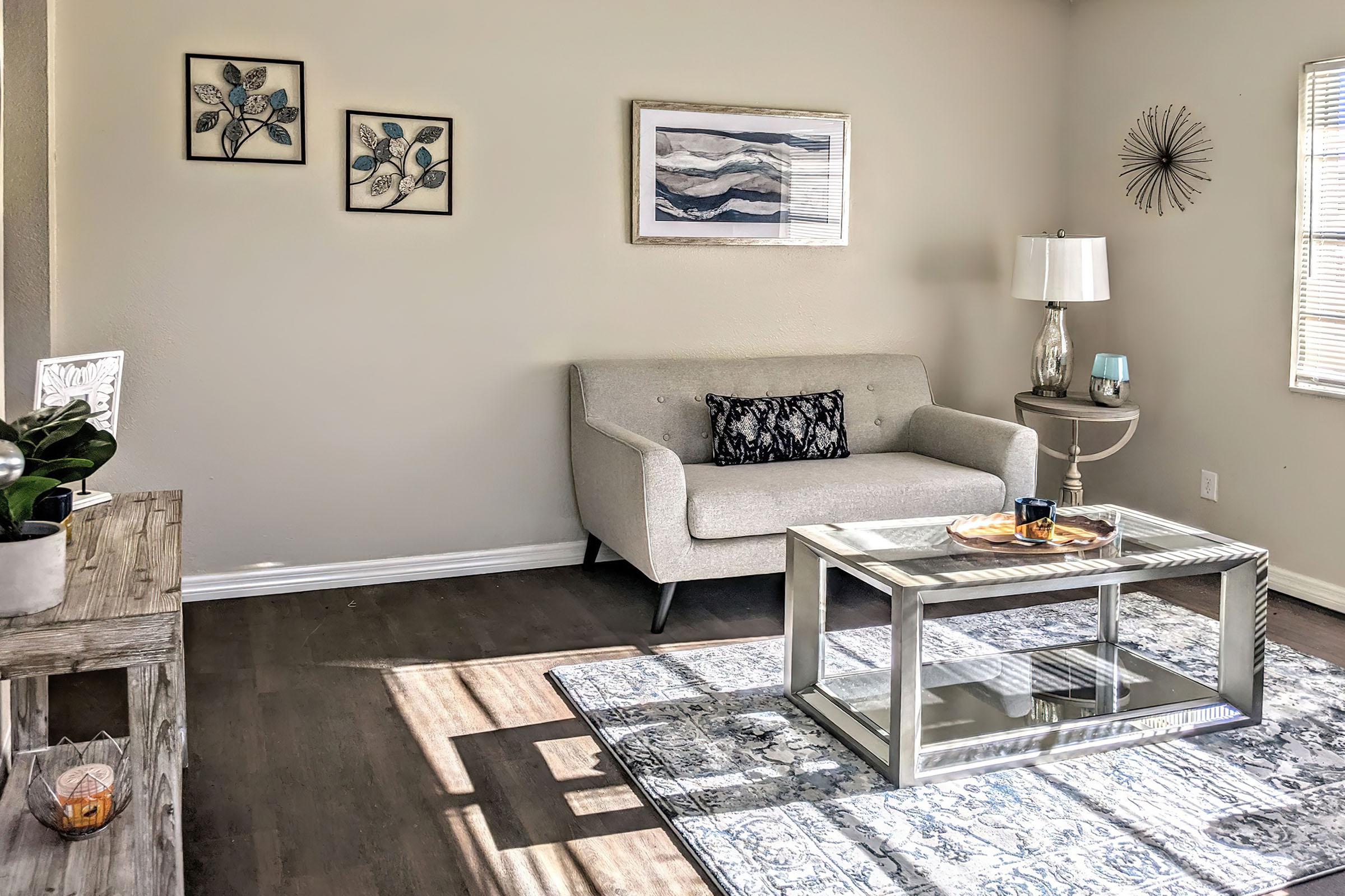 a living room filled with furniture and a table