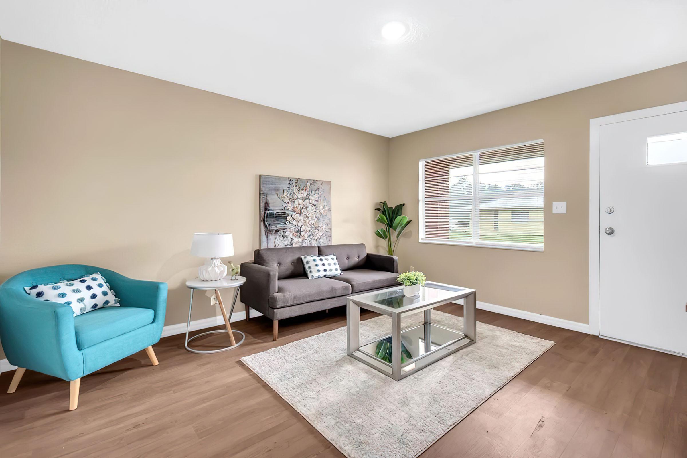 a living room filled with furniture and a flat screen tv