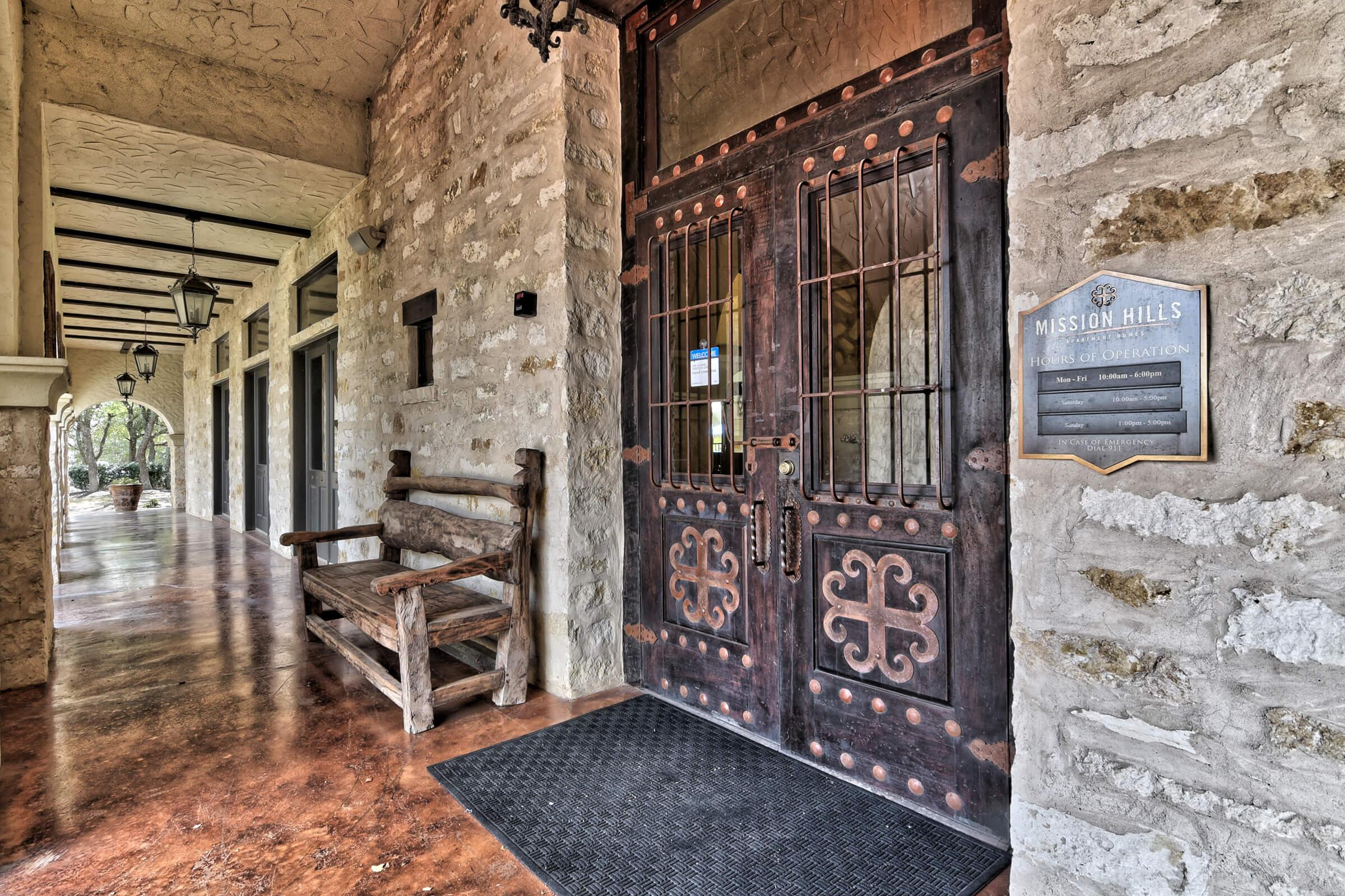 a close up of a stone building that has a glass door