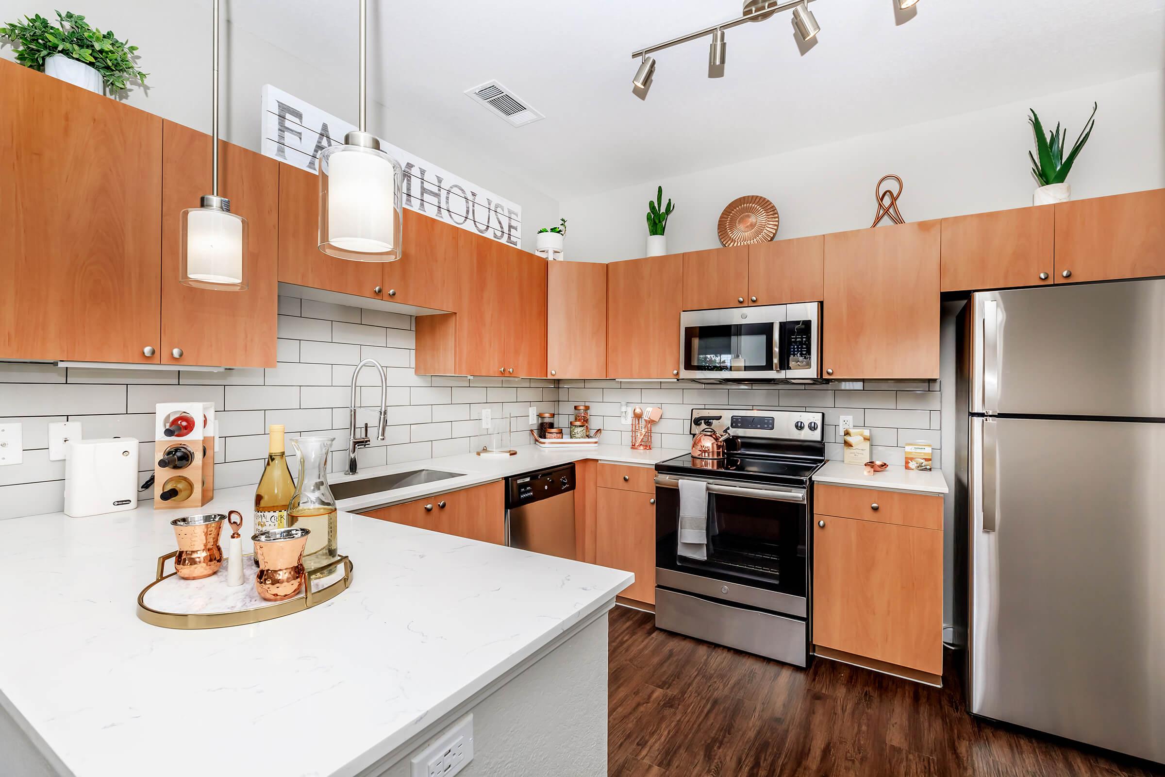 a modern kitchen with stainless steel appliances