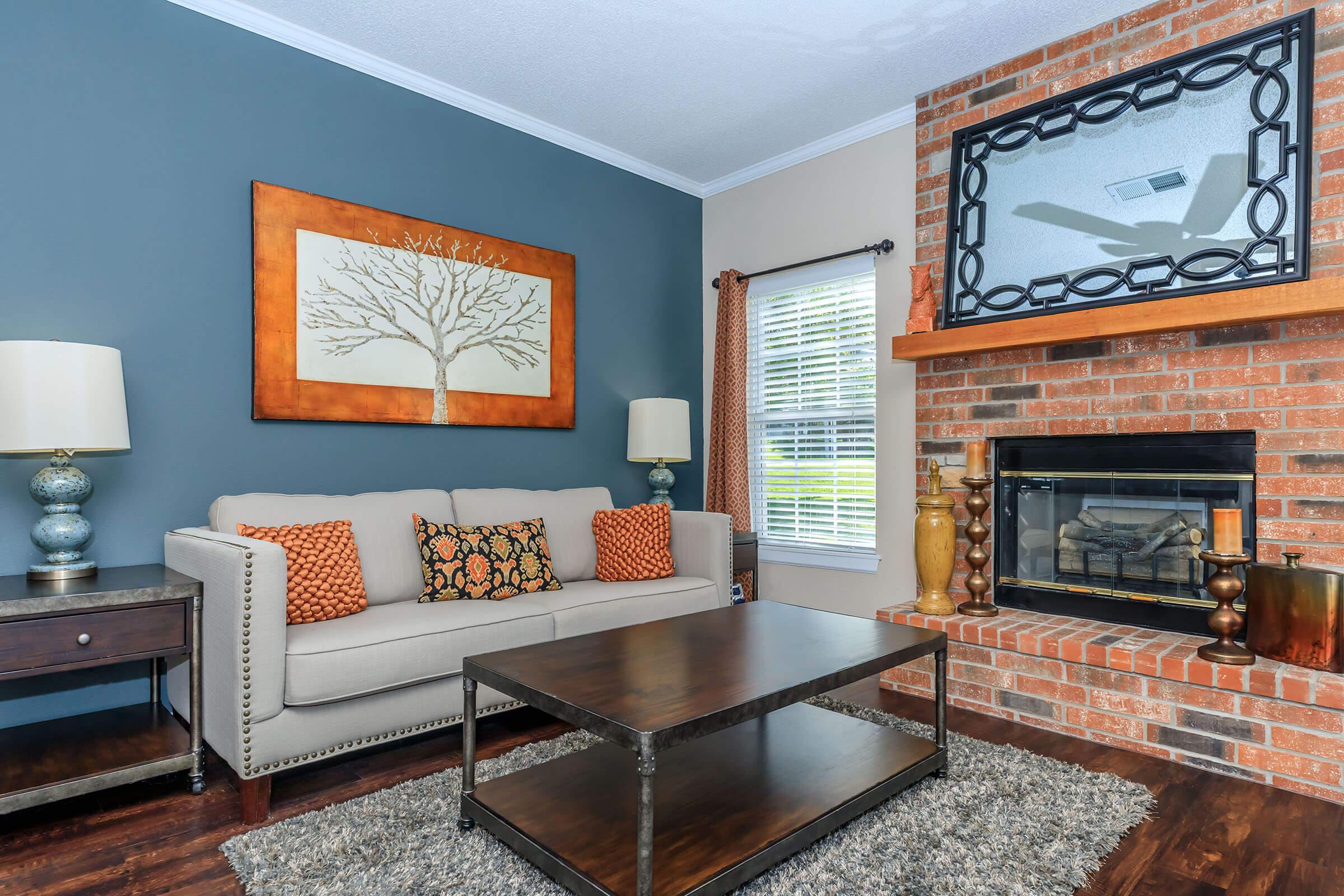 a fire place sitting in a living room with a fireplace