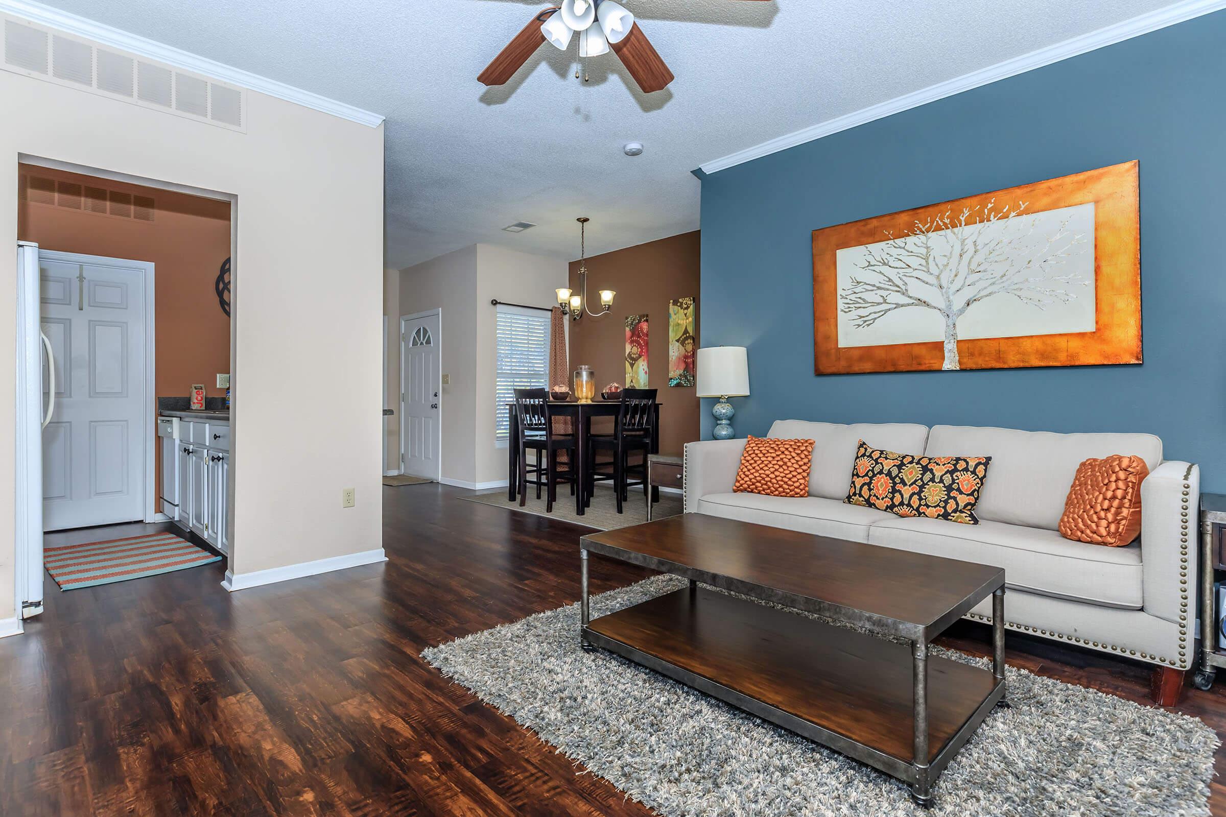 a living room filled with furniture and a fireplace