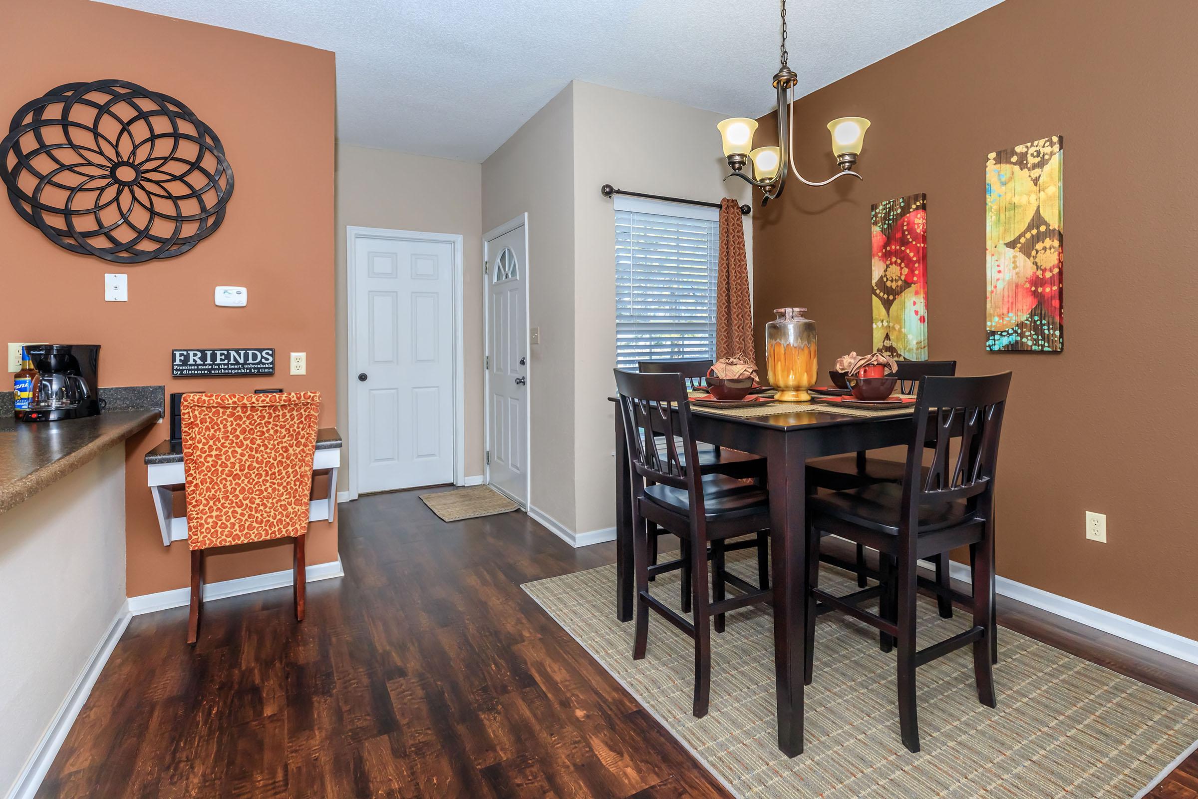 a living room filled with furniture and a wood floor