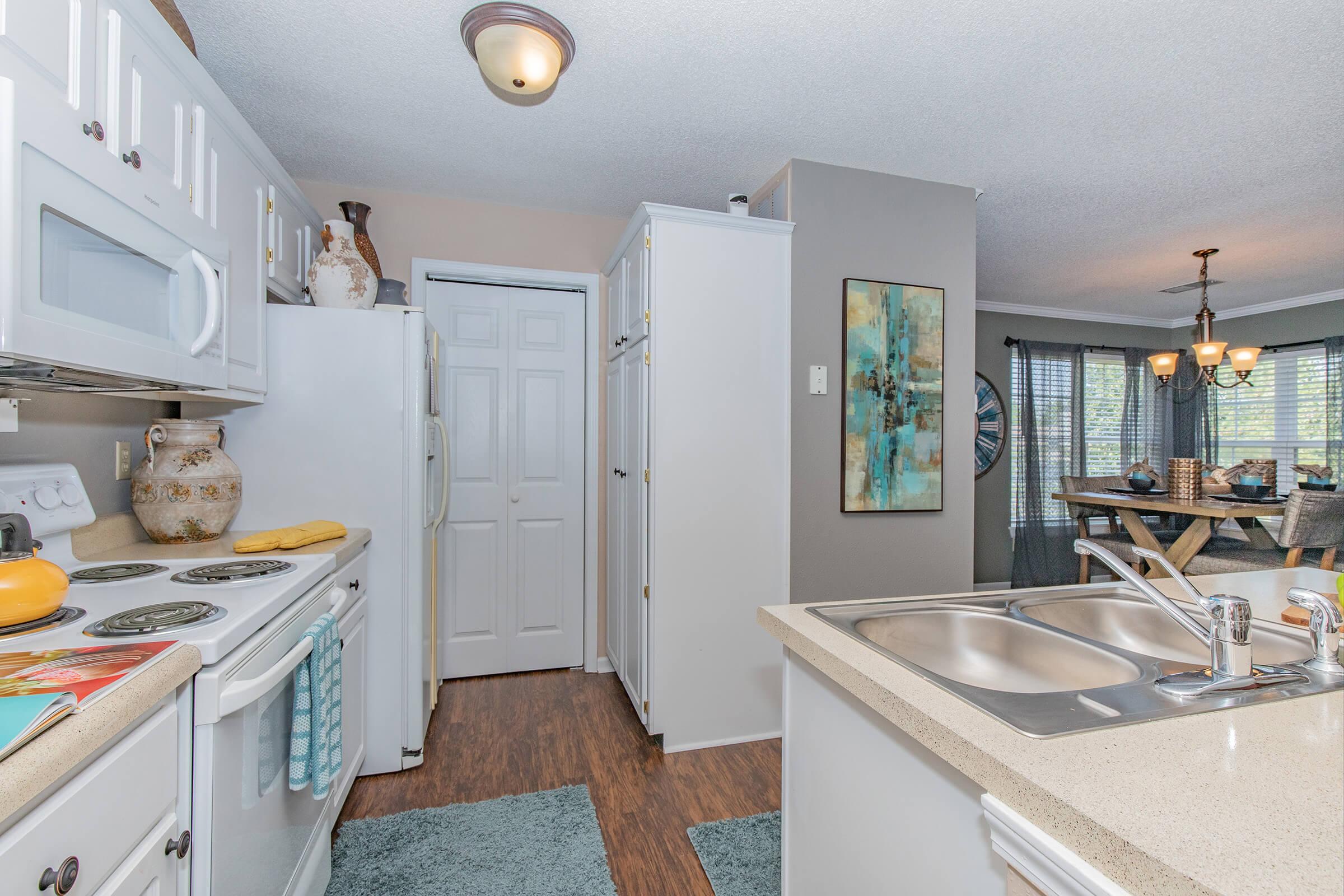 a kitchen with an island in the middle of a room