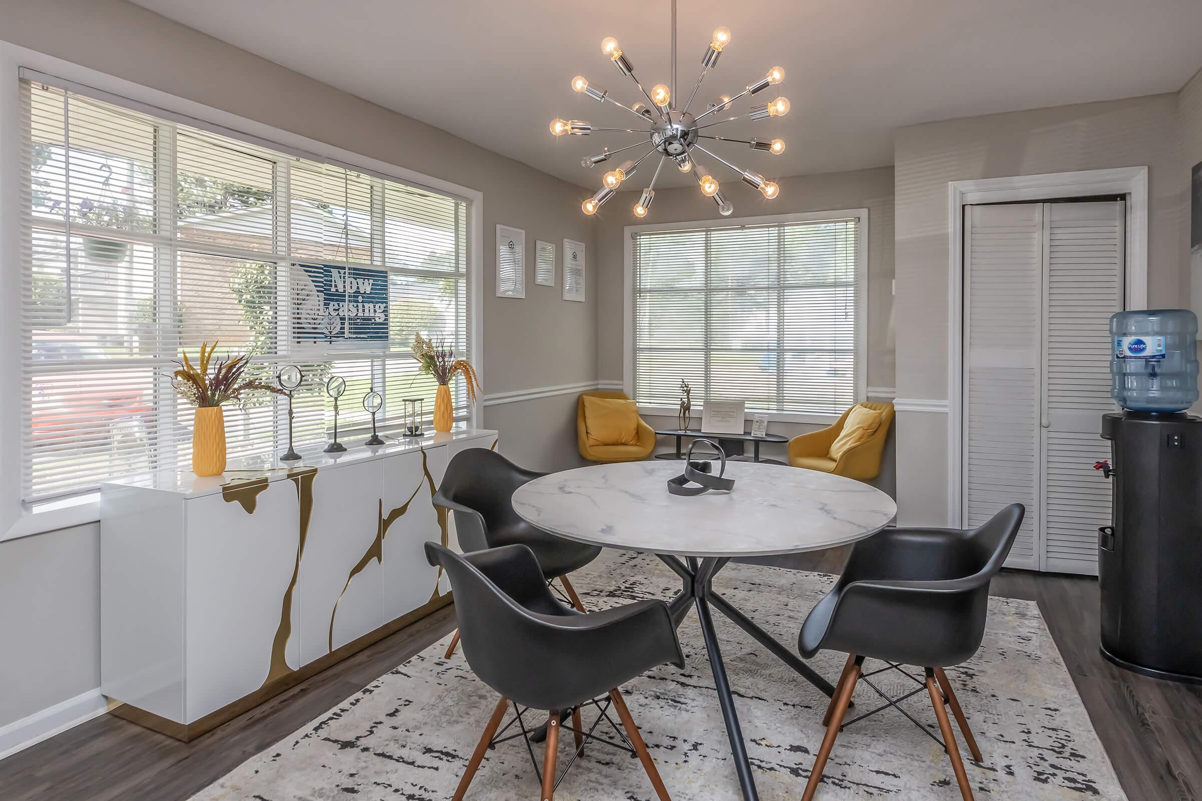 a dining room table in front of a window