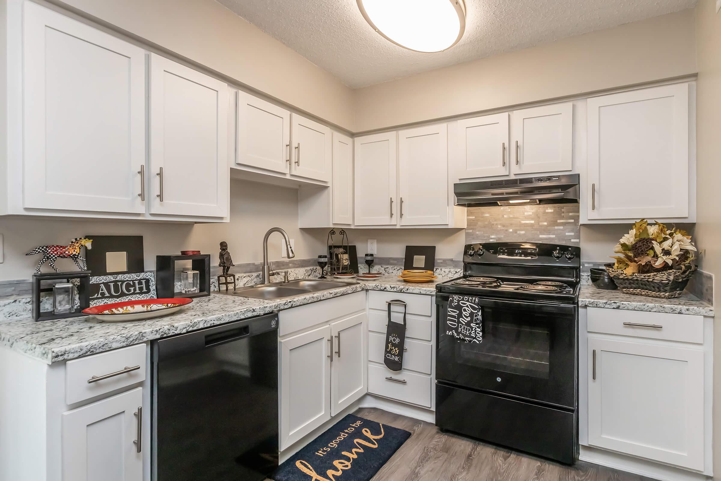 a kitchen with a sink and a microwave