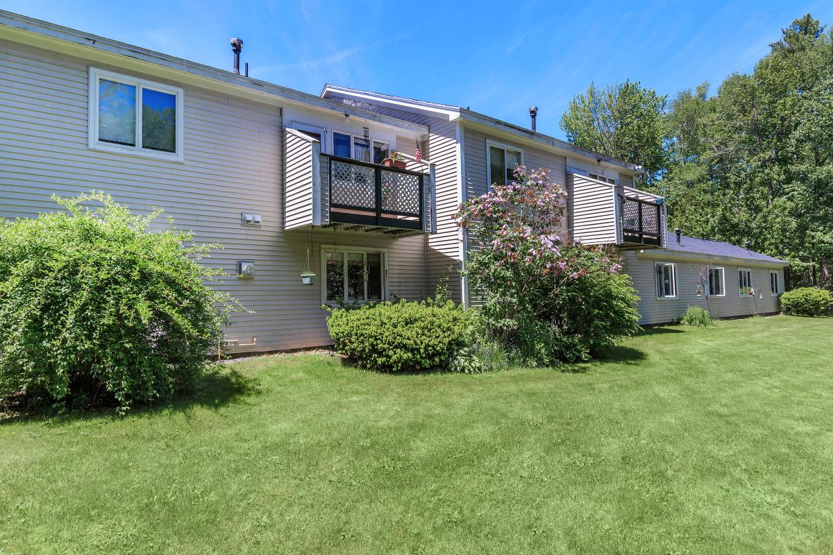 a large lawn in front of a house