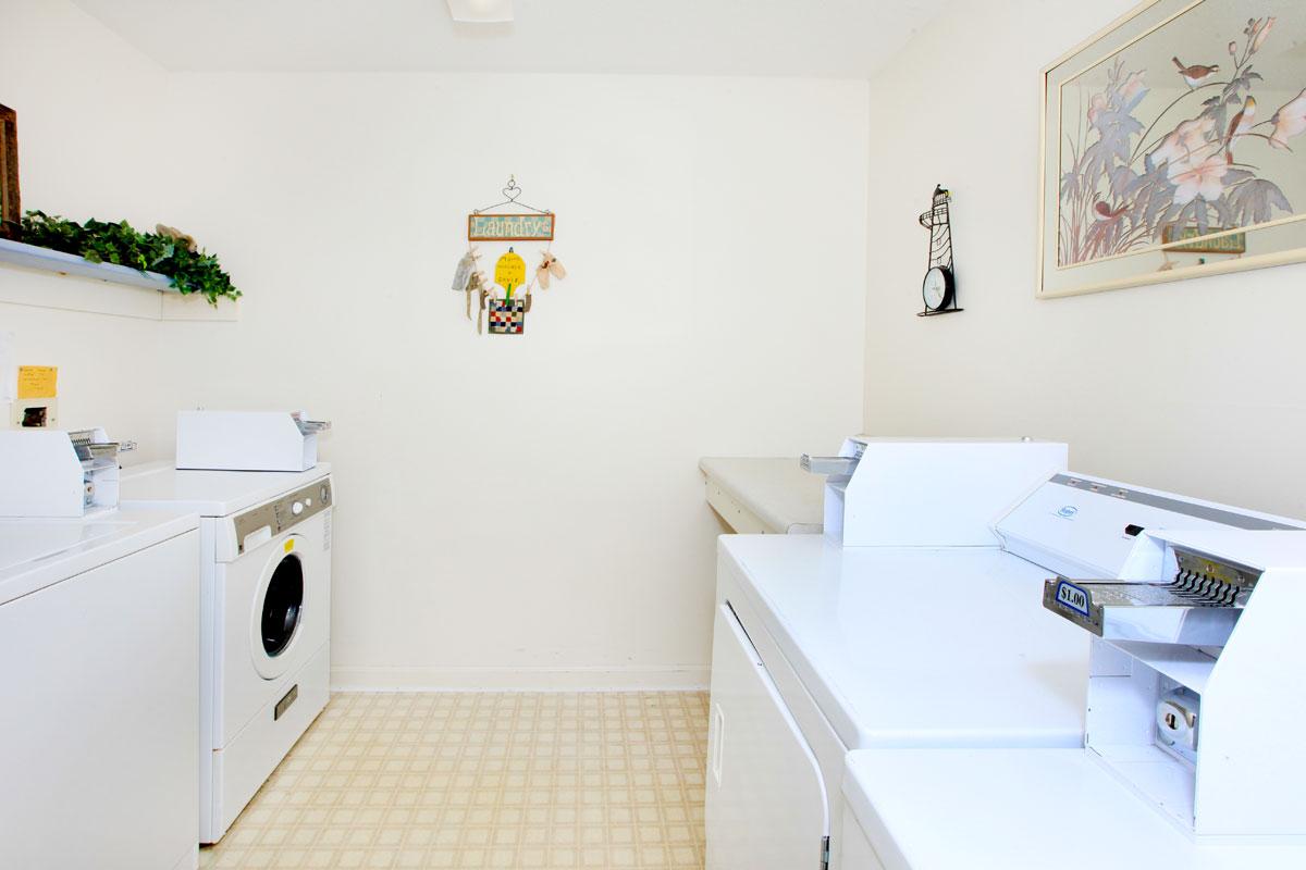 a white refrigerator freezer sitting next to a sink