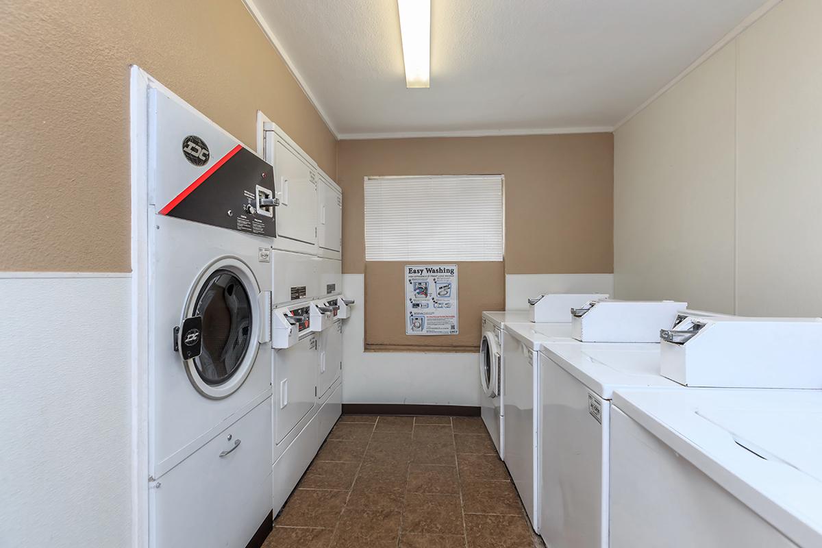 a large white refrigerator in a kitchen