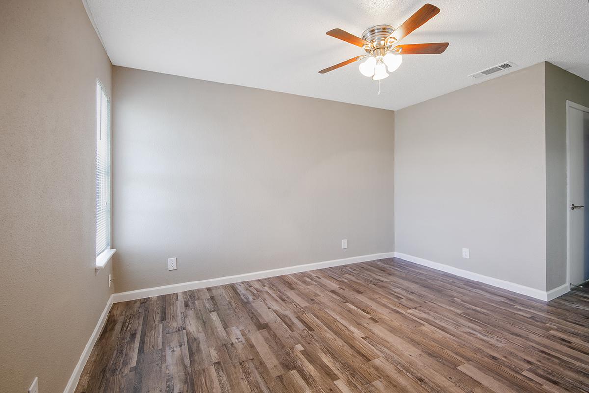 a large empty room with a wooden floor