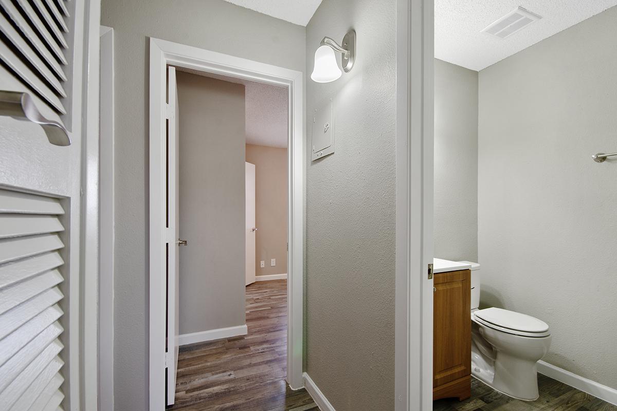 a white sink sitting next to a door