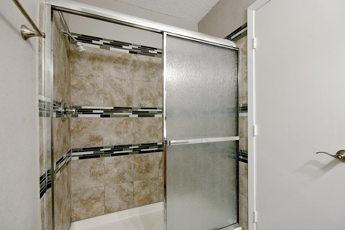 a white refrigerator freezer sitting next to a door