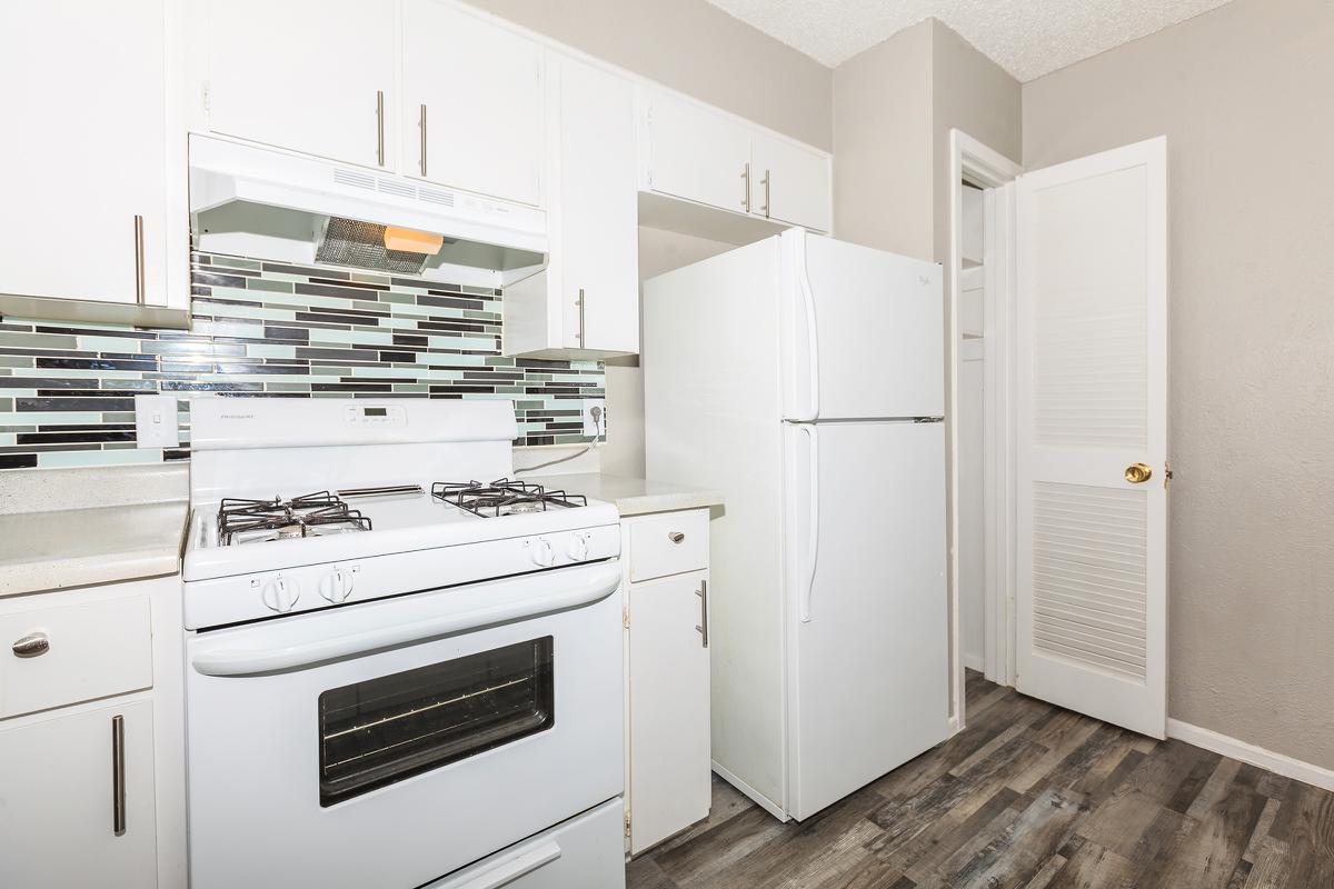 a white refrigerator freezer sitting inside of a kitchen