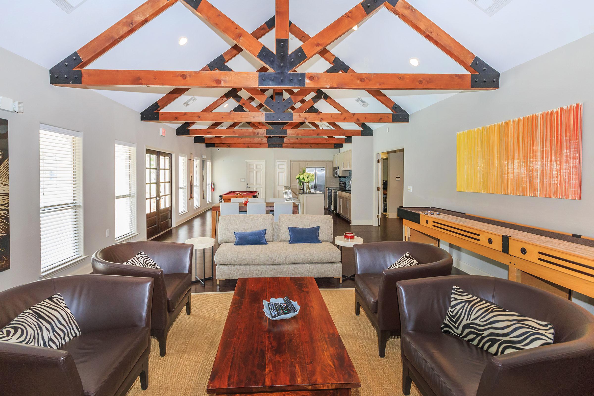 a living room filled with furniture and a large window