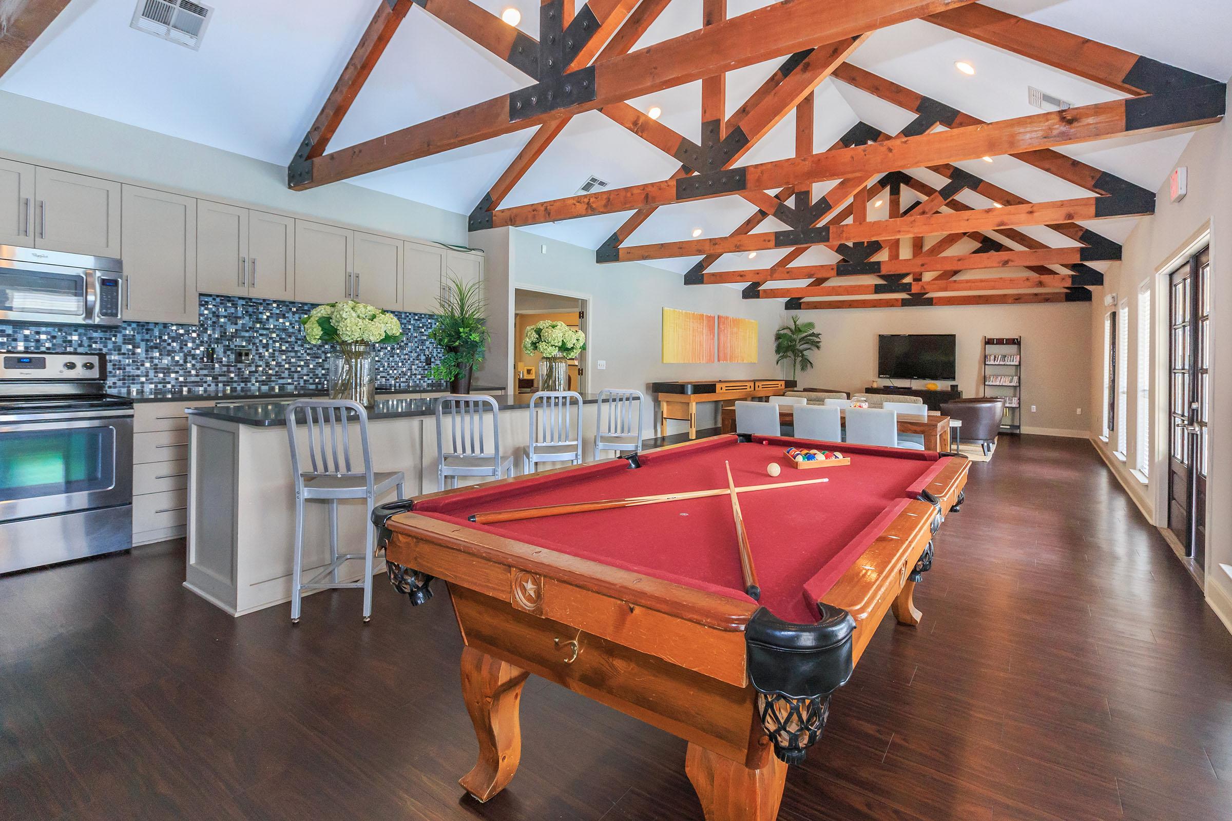 a room filled with furniture on top of a wooden floor