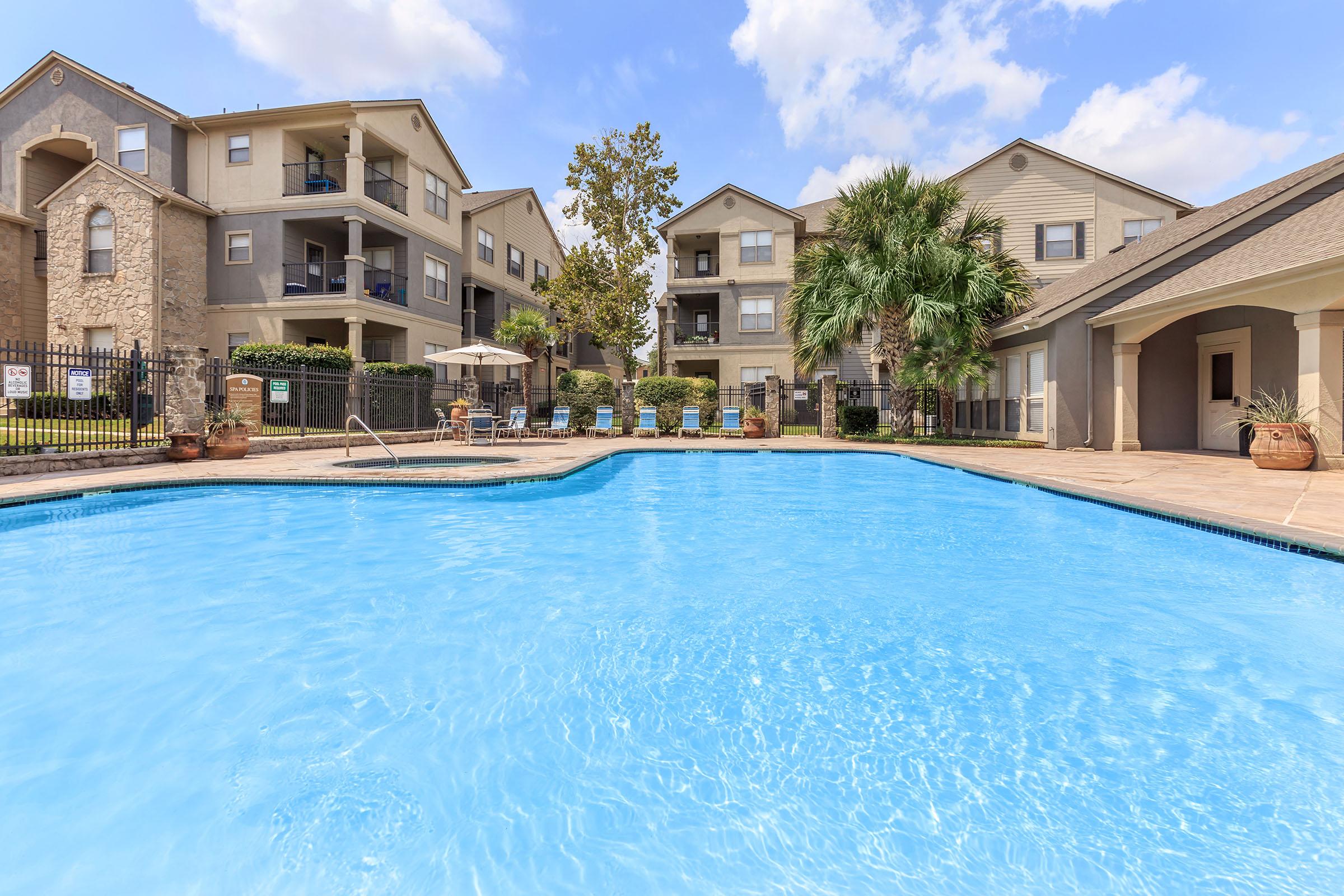 a house with a large pool of water