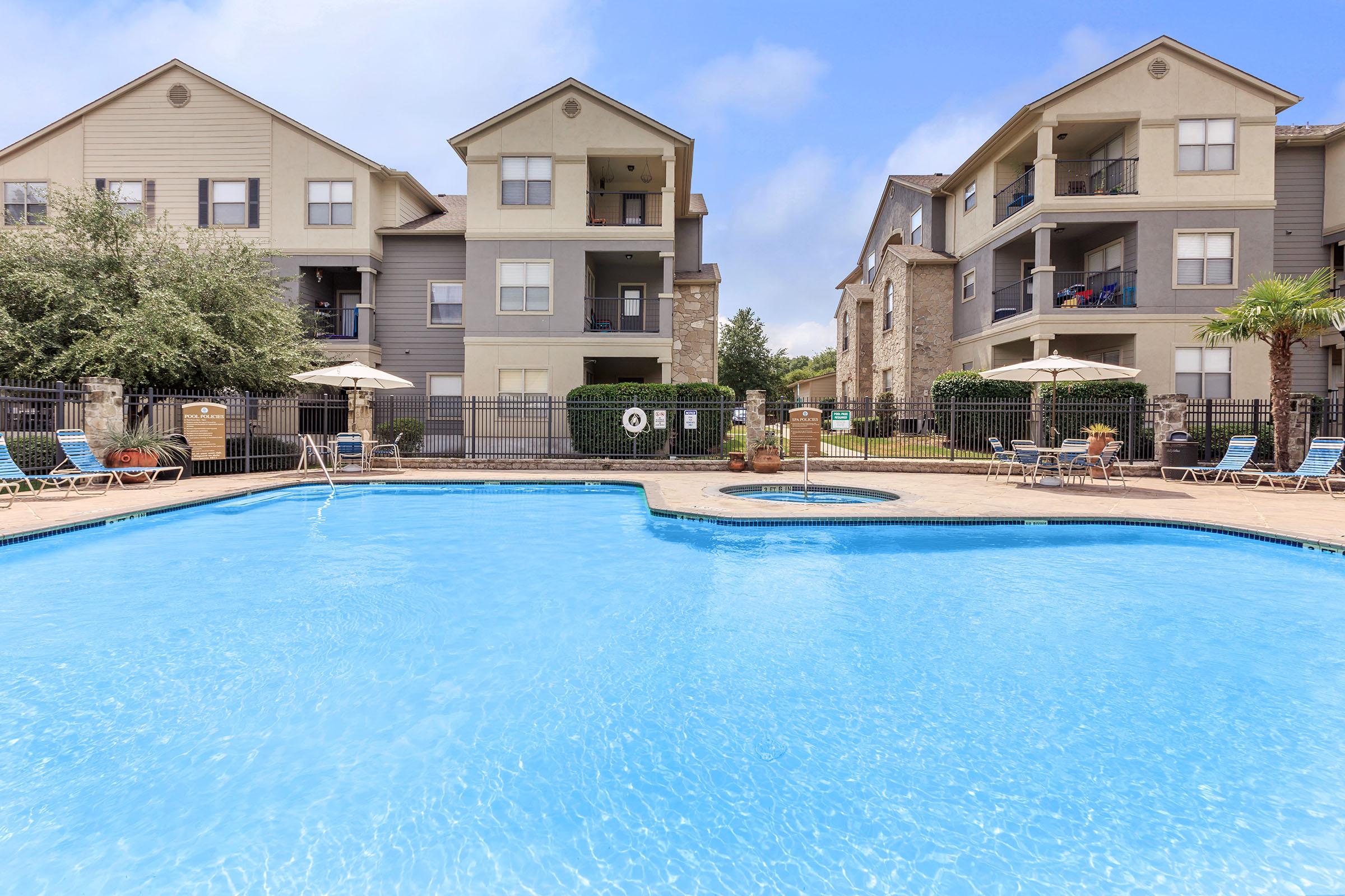 a house with a large pool of water