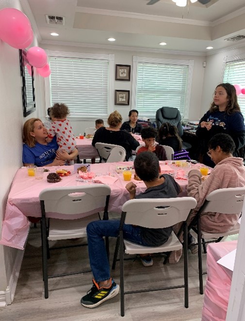 a group of people sitting at a table