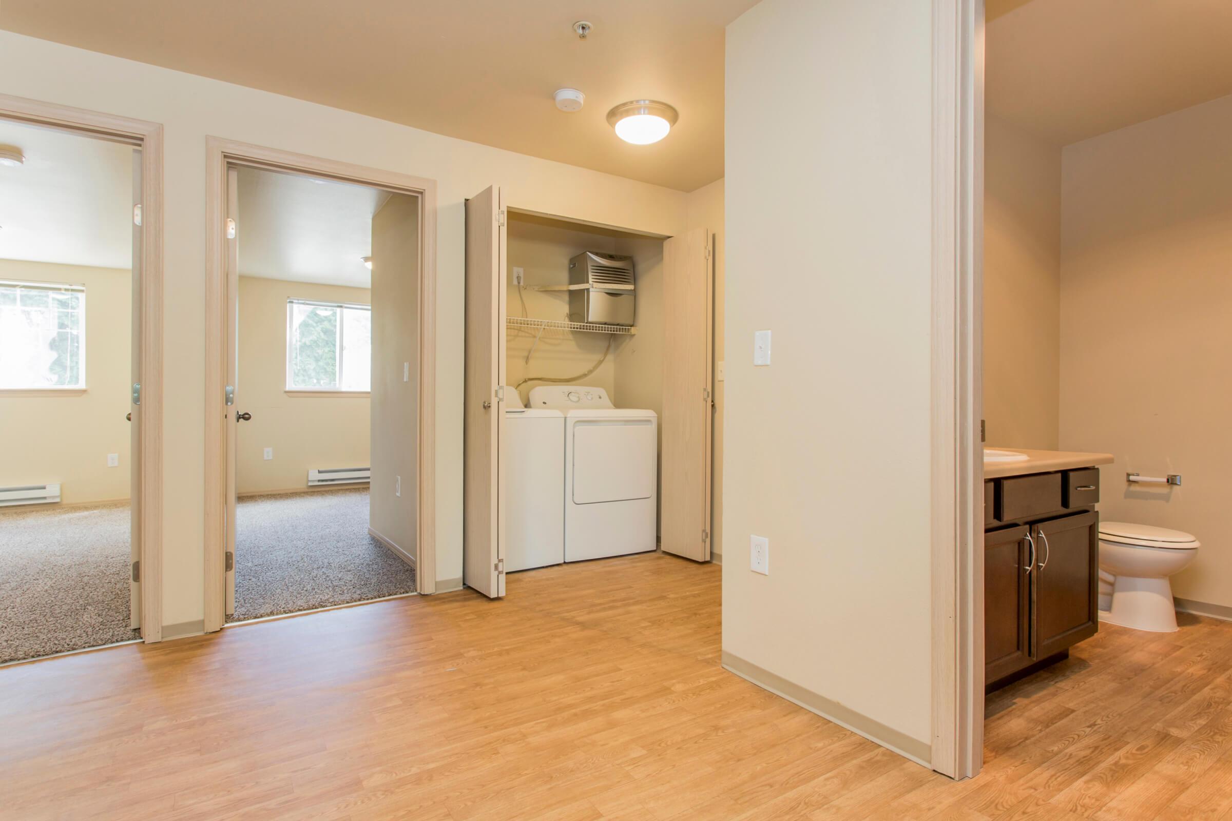 a kitchen with a wood floor