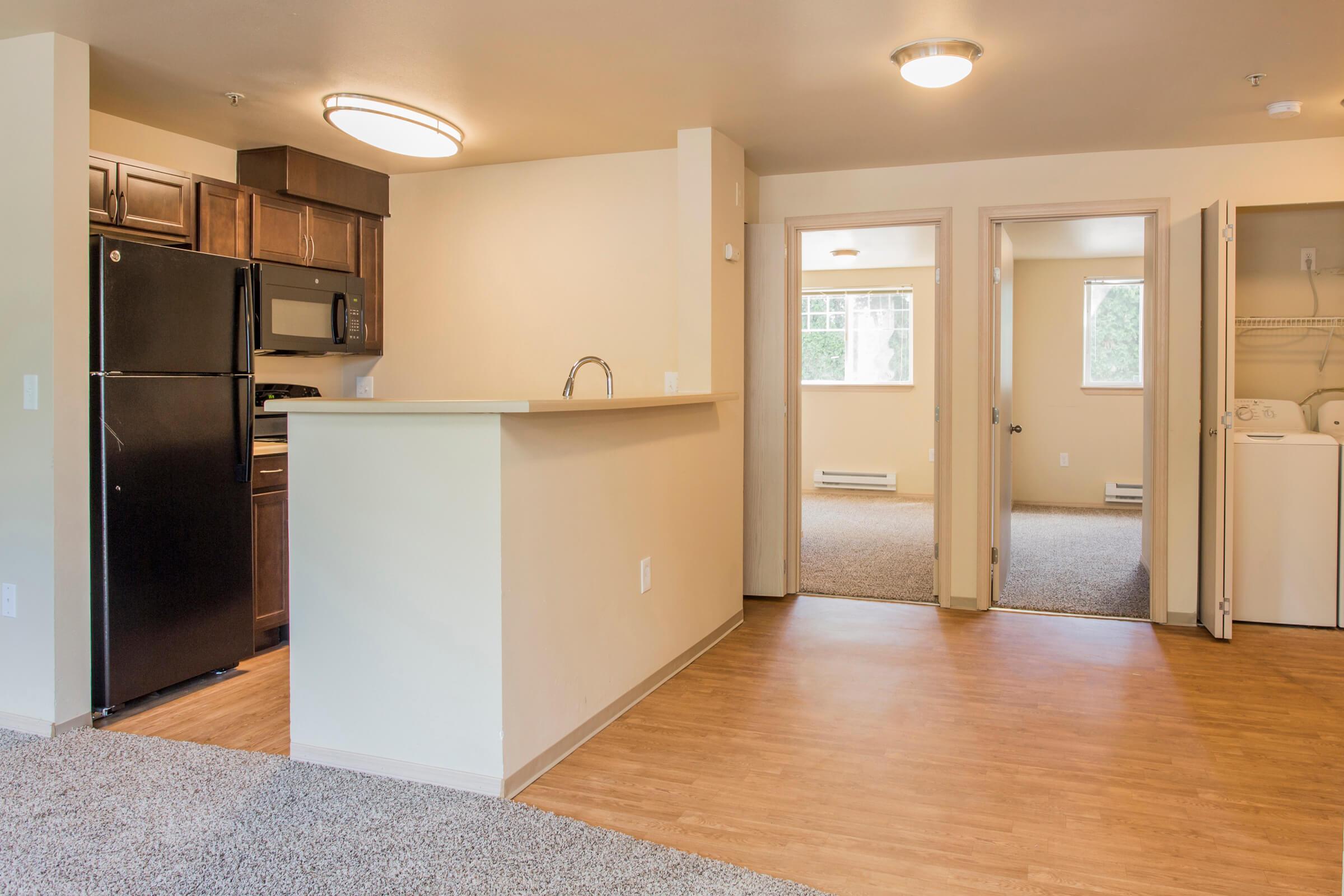 a kitchen with a wood floor