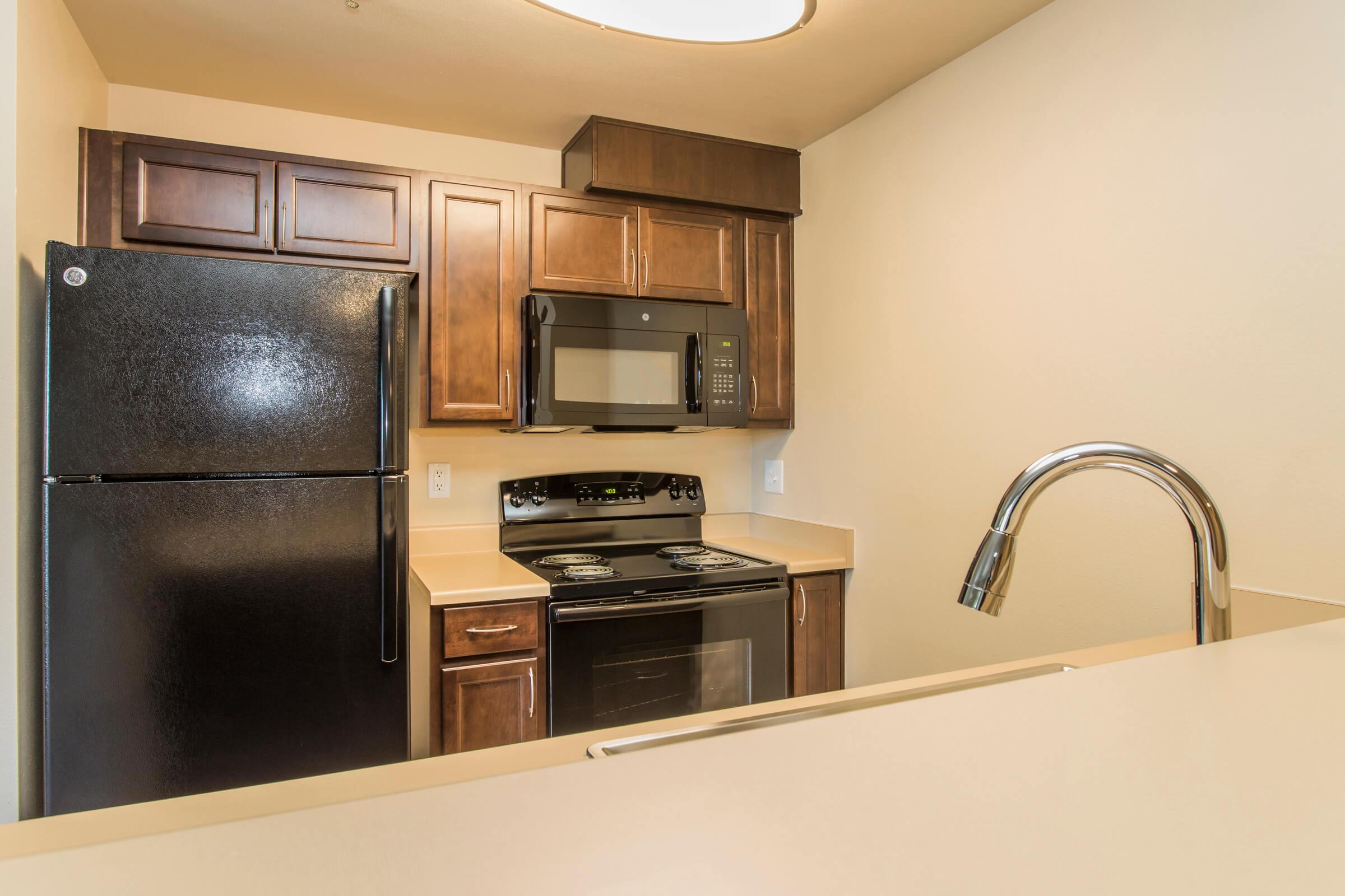 a kitchen with a stove top oven sitting inside of a refrigerator