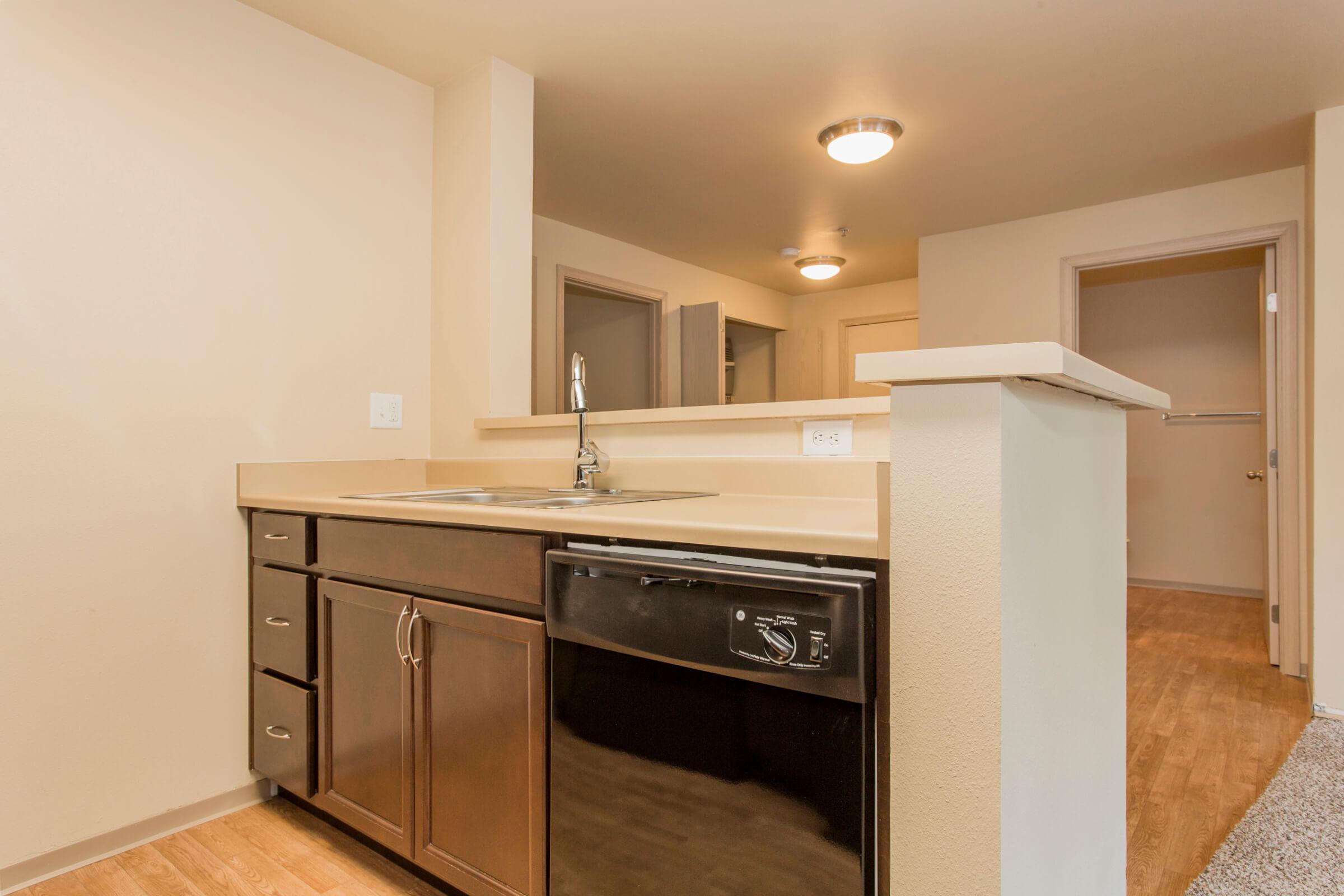 a kitchen with a wood floor