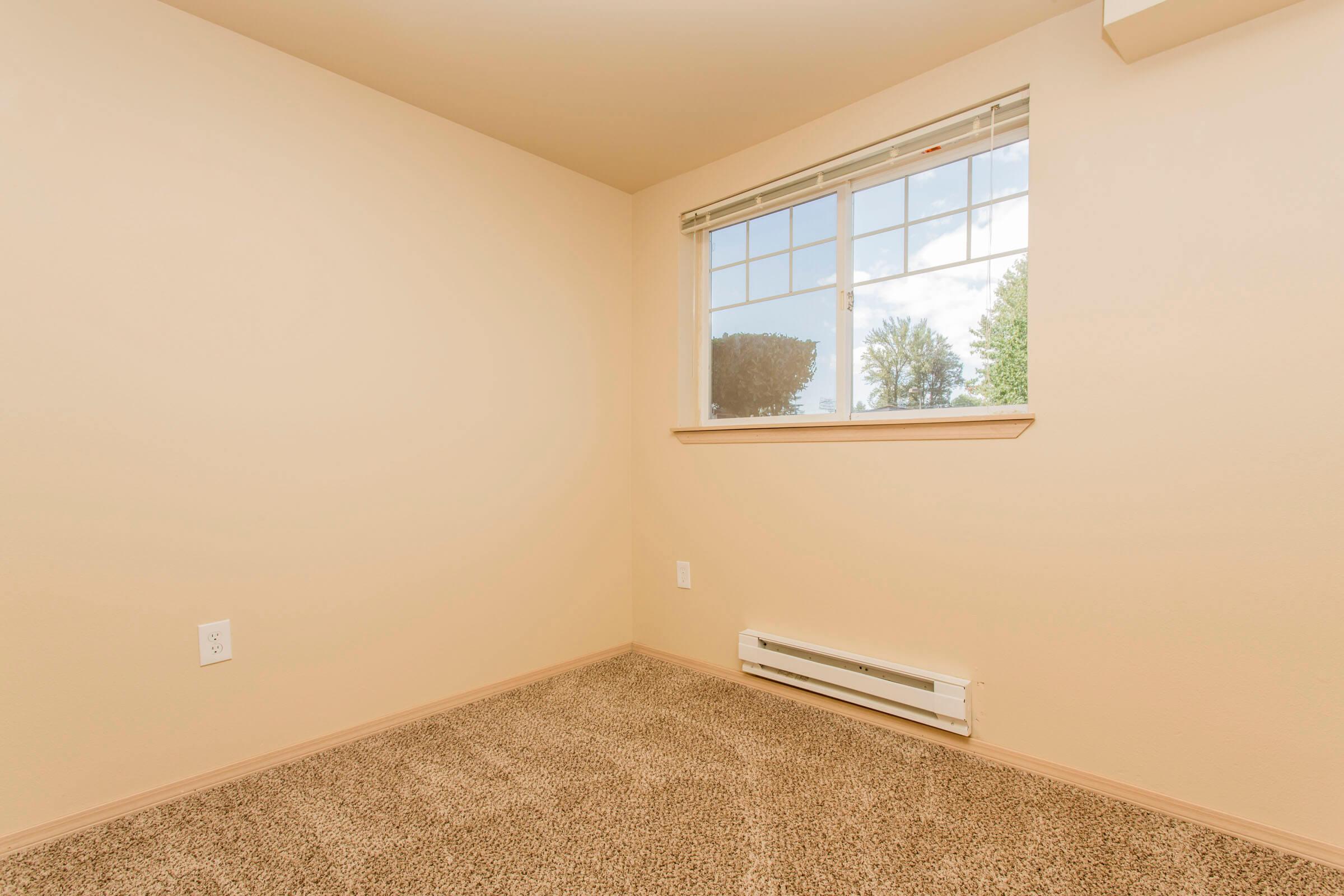 a bedroom with a large window