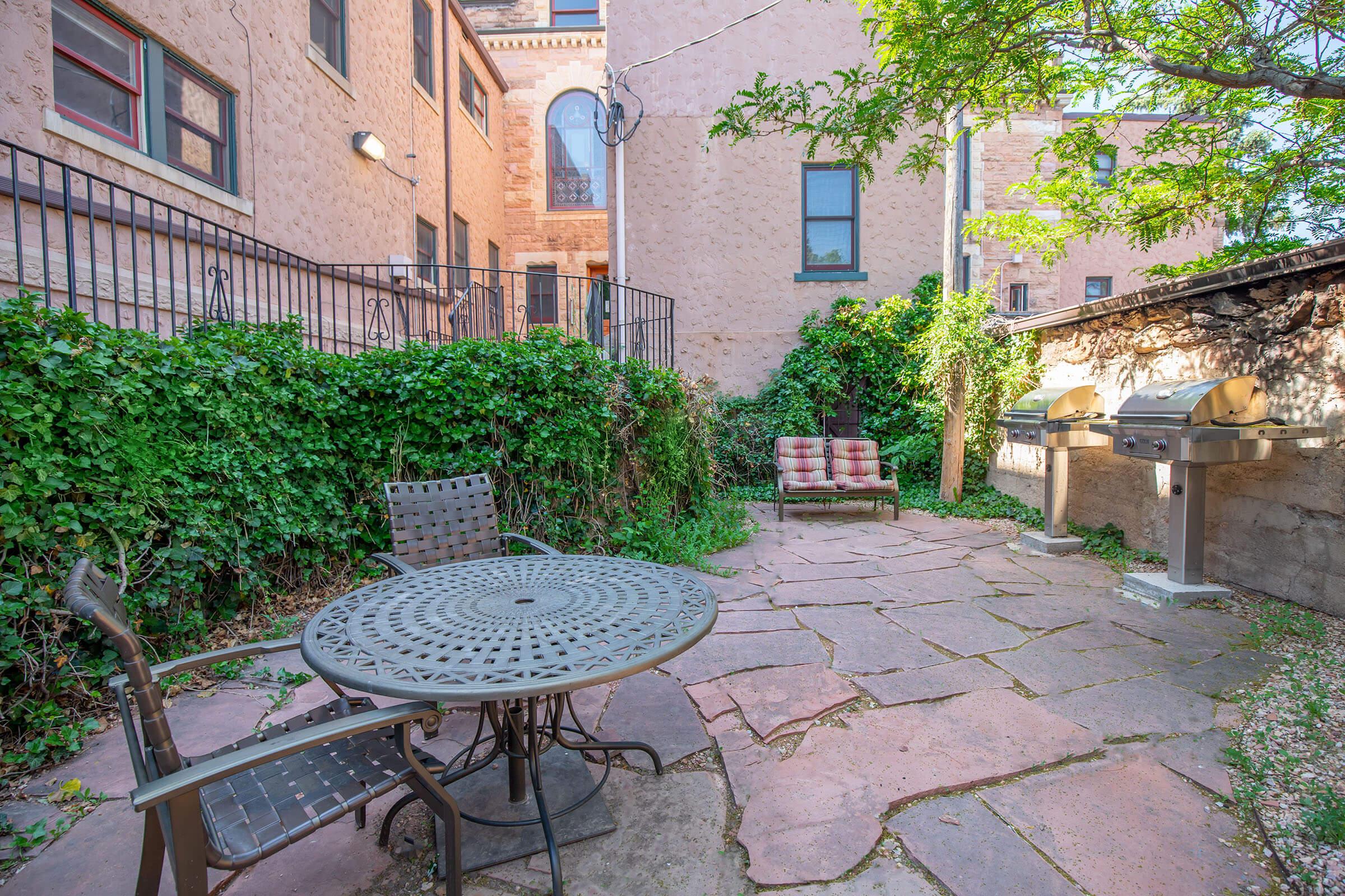 a bench in front of a brick building