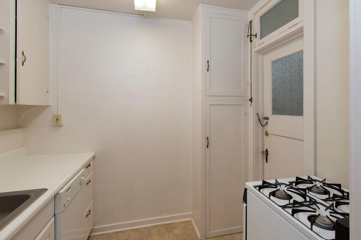 a kitchen with a stove and a sink