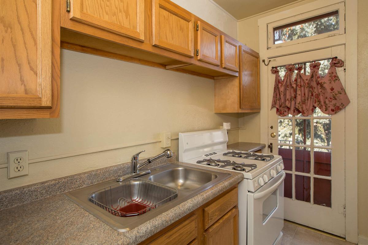 a kitchen with a stove and a sink