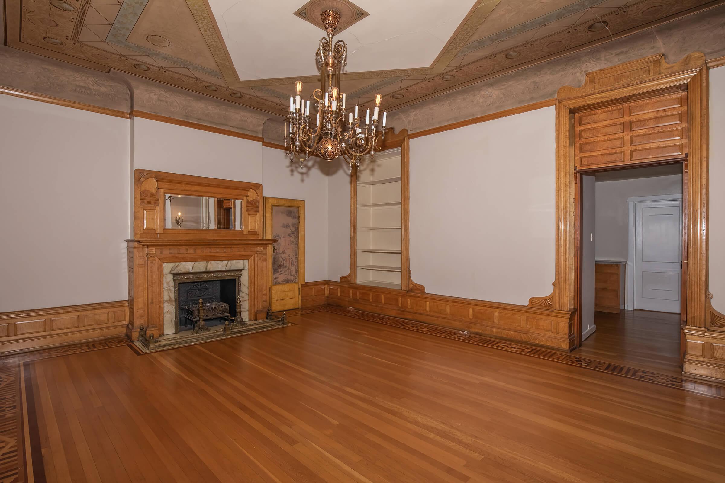 a living room filled with furniture and a fireplace