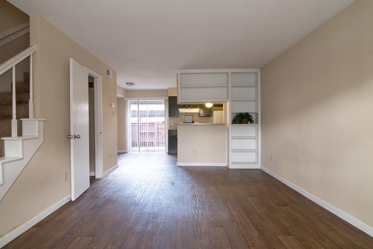 a large empty room with a wood floor