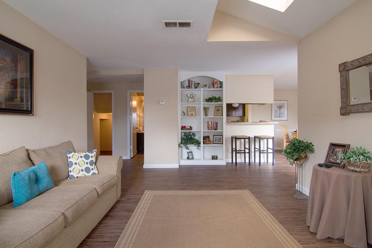 a living room filled with furniture and a flat screen tv