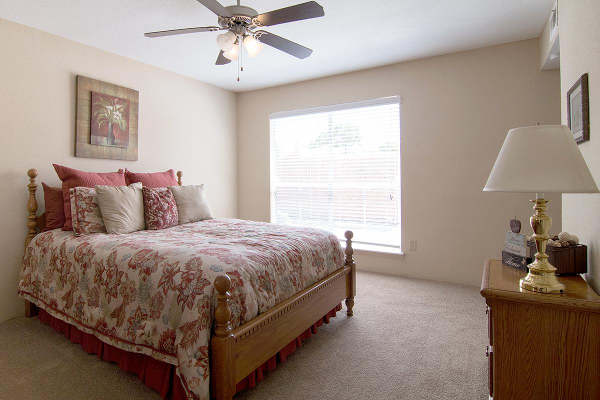 a bedroom with a bed in a hotel room