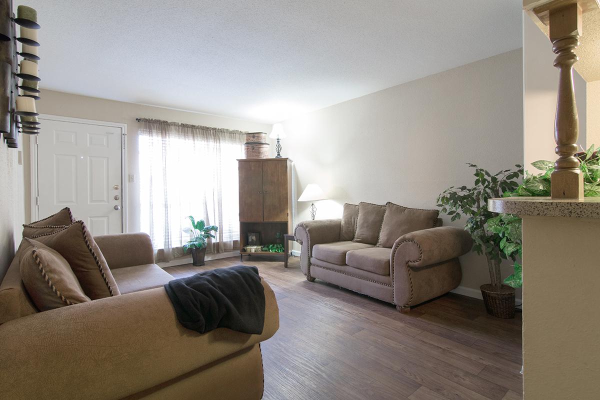 a living room filled with furniture and a fire place