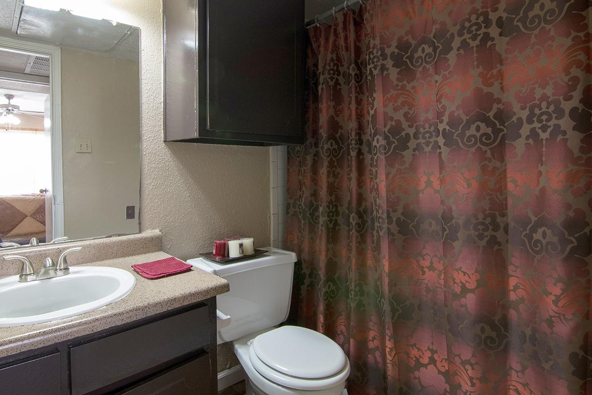 a white tub sitting next to a sink