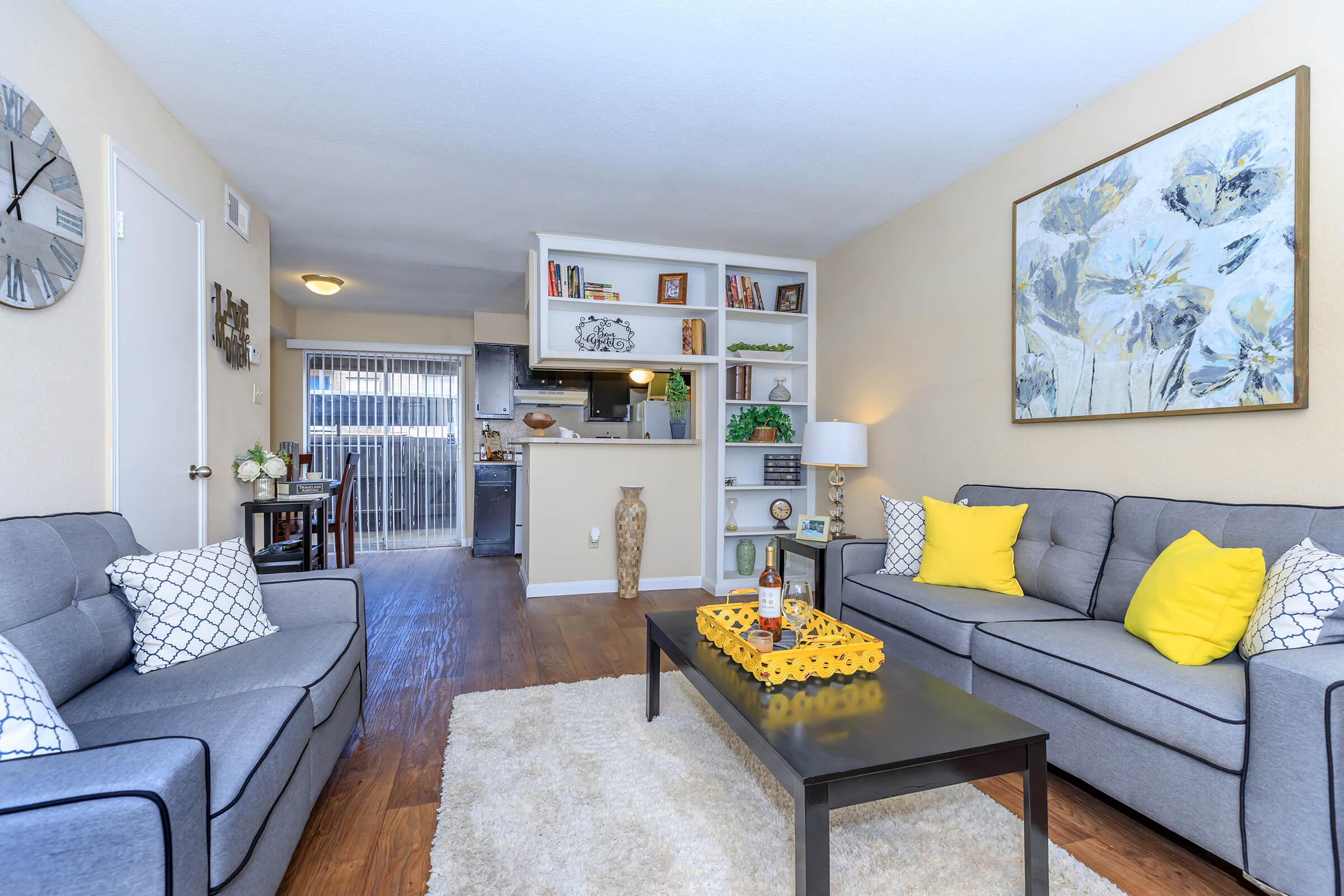 a living room filled with furniture and a fire place